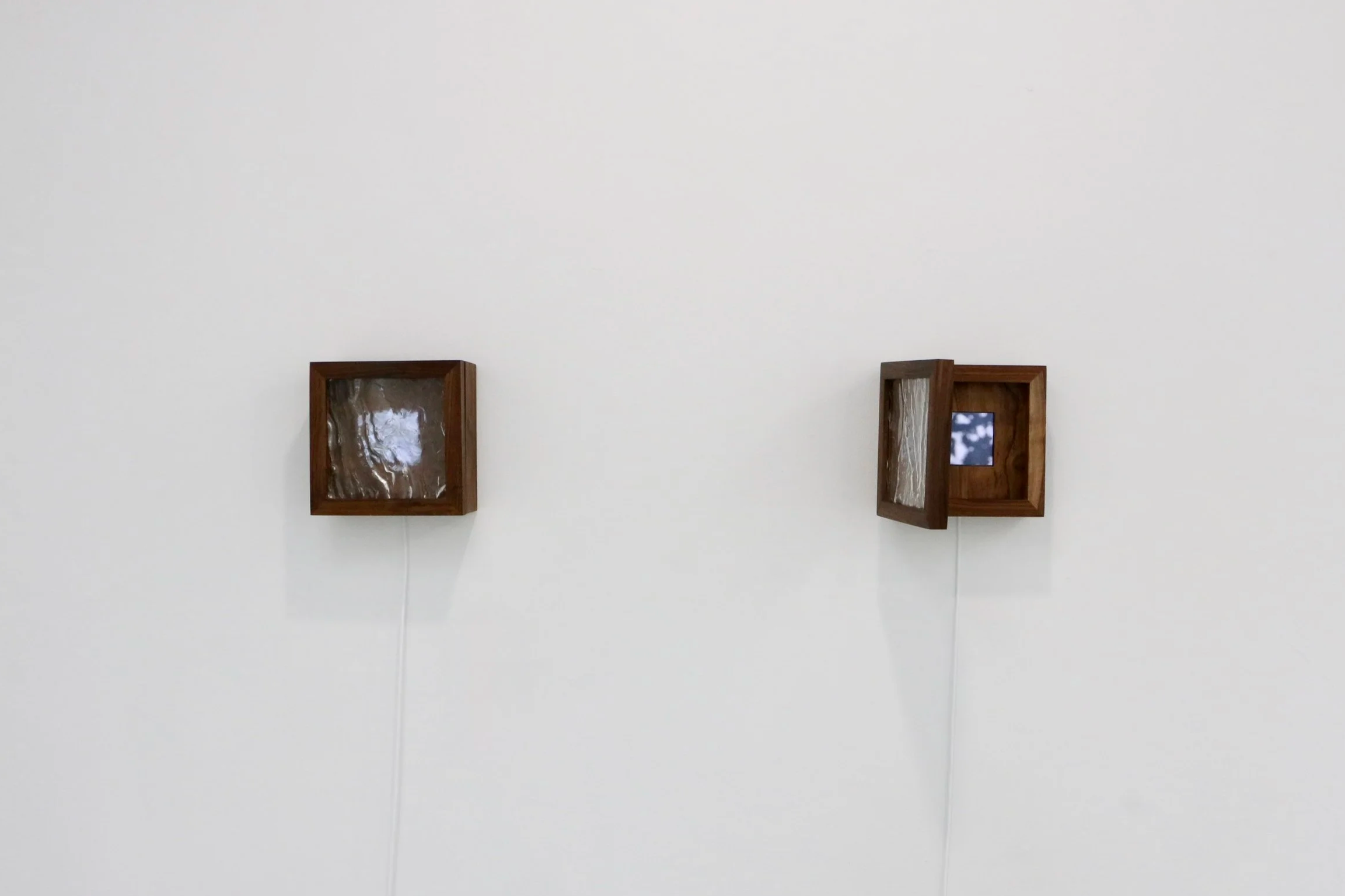 
Portals, 2026
8 x 8 x 3.5 inches

Wood, cast glass, natural phenomena on video, TFT display, steel hinges

