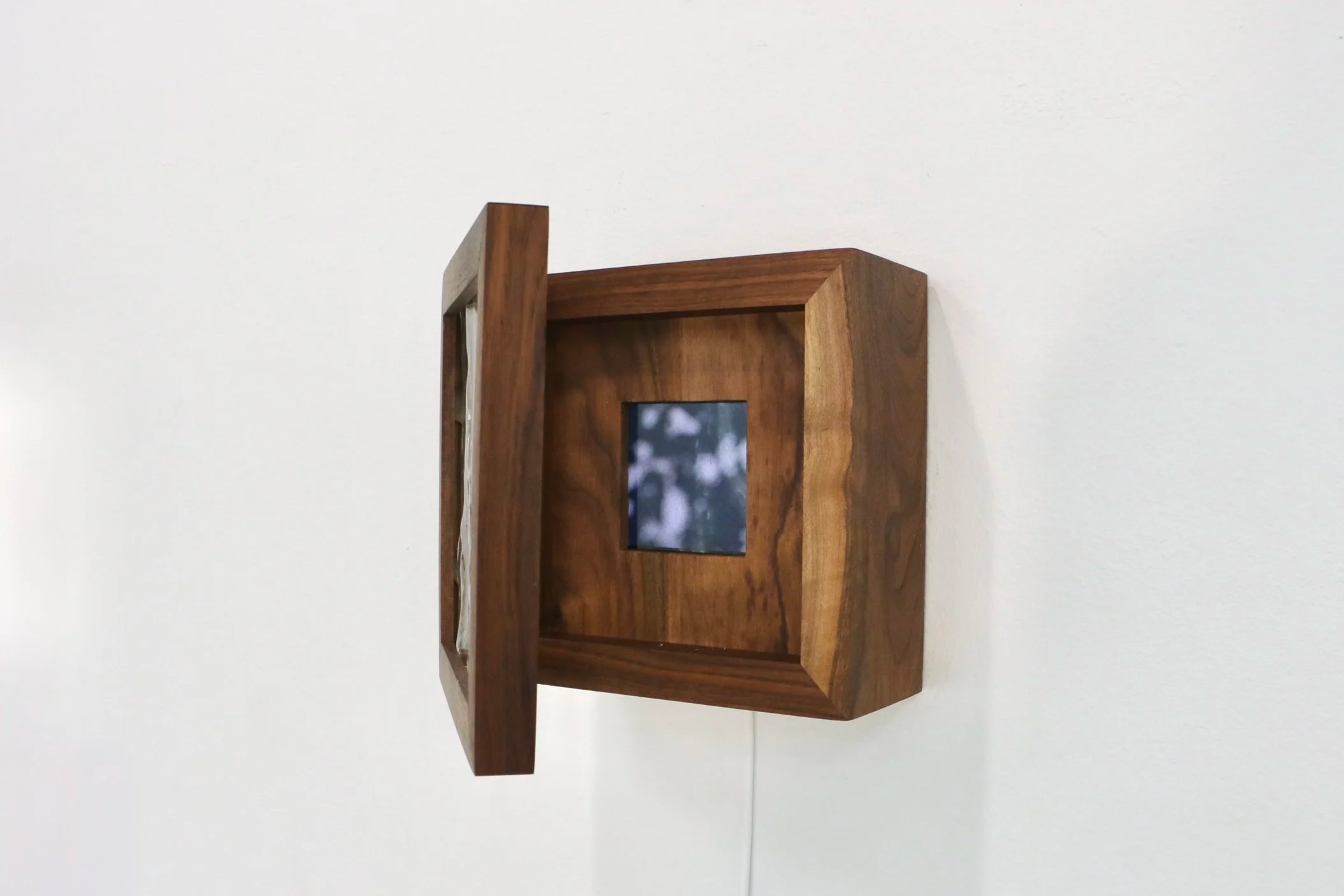 
Portals, 2026
8 x 8 x 3.5 inches

Wood, cast glass, natural phenomena on video, TFT display, steel hinges
