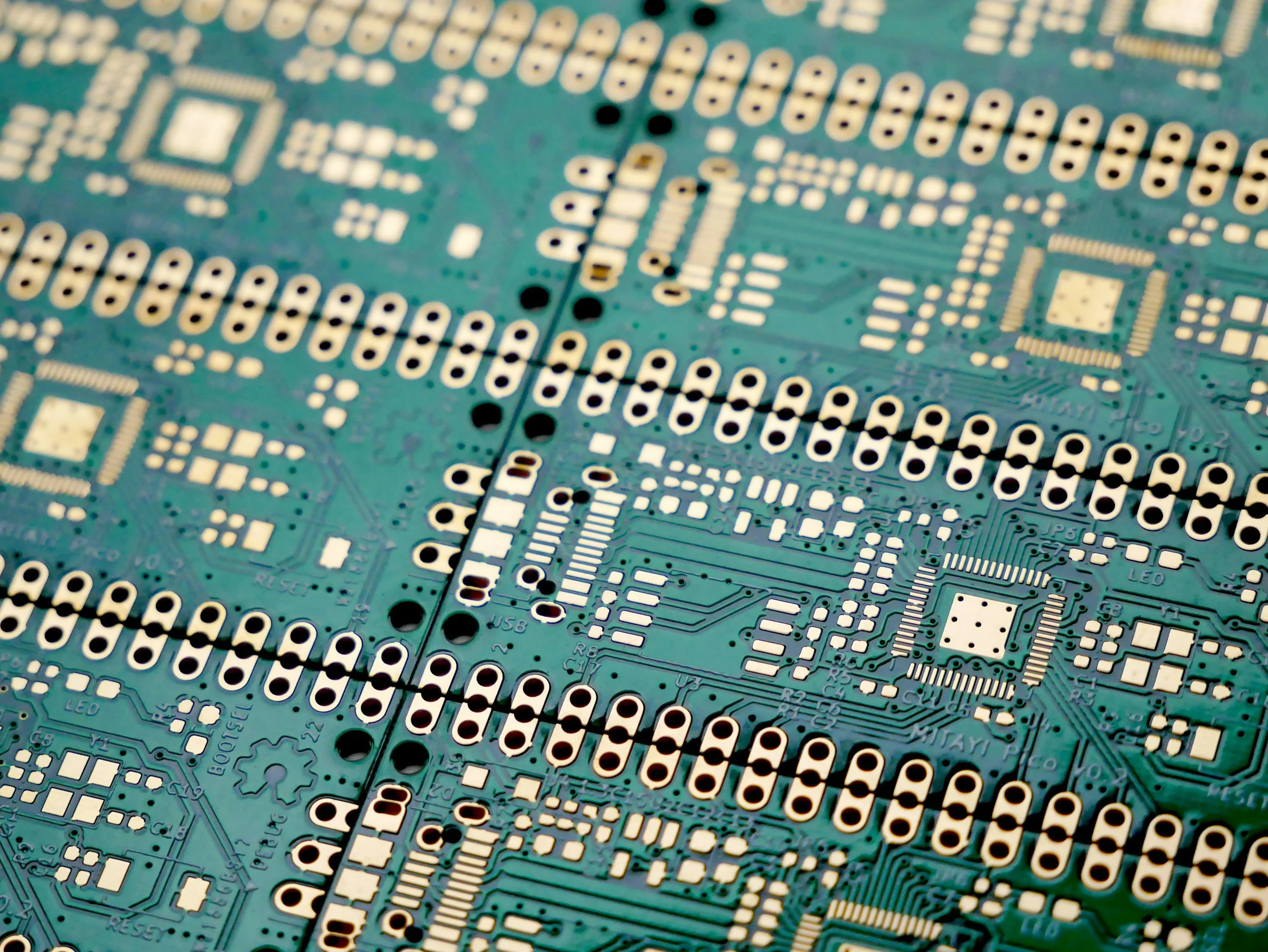 Close-up of a printed circuit board with electronic components and circuitry.