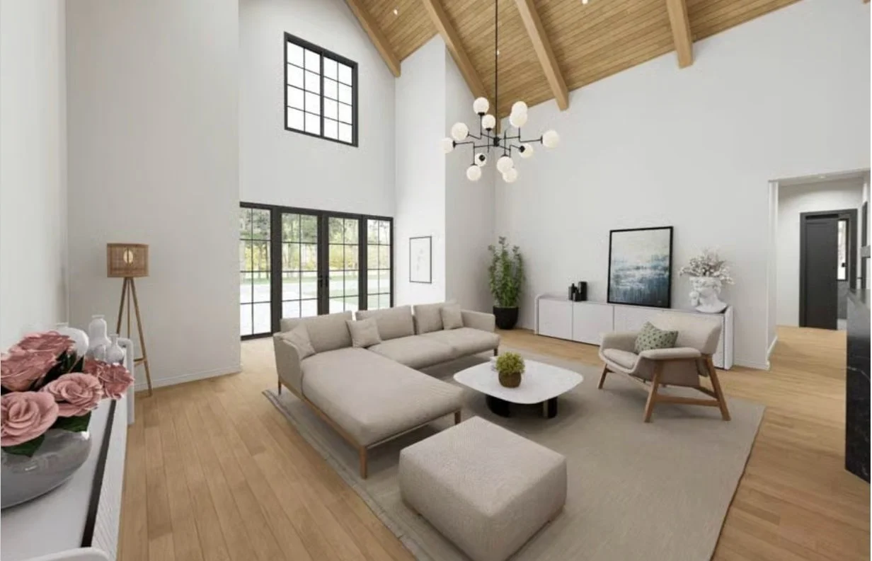 Living room with white walls, large black-framed windows, beige sofa, white armchair, wooden ceiling, and modern chandelier.