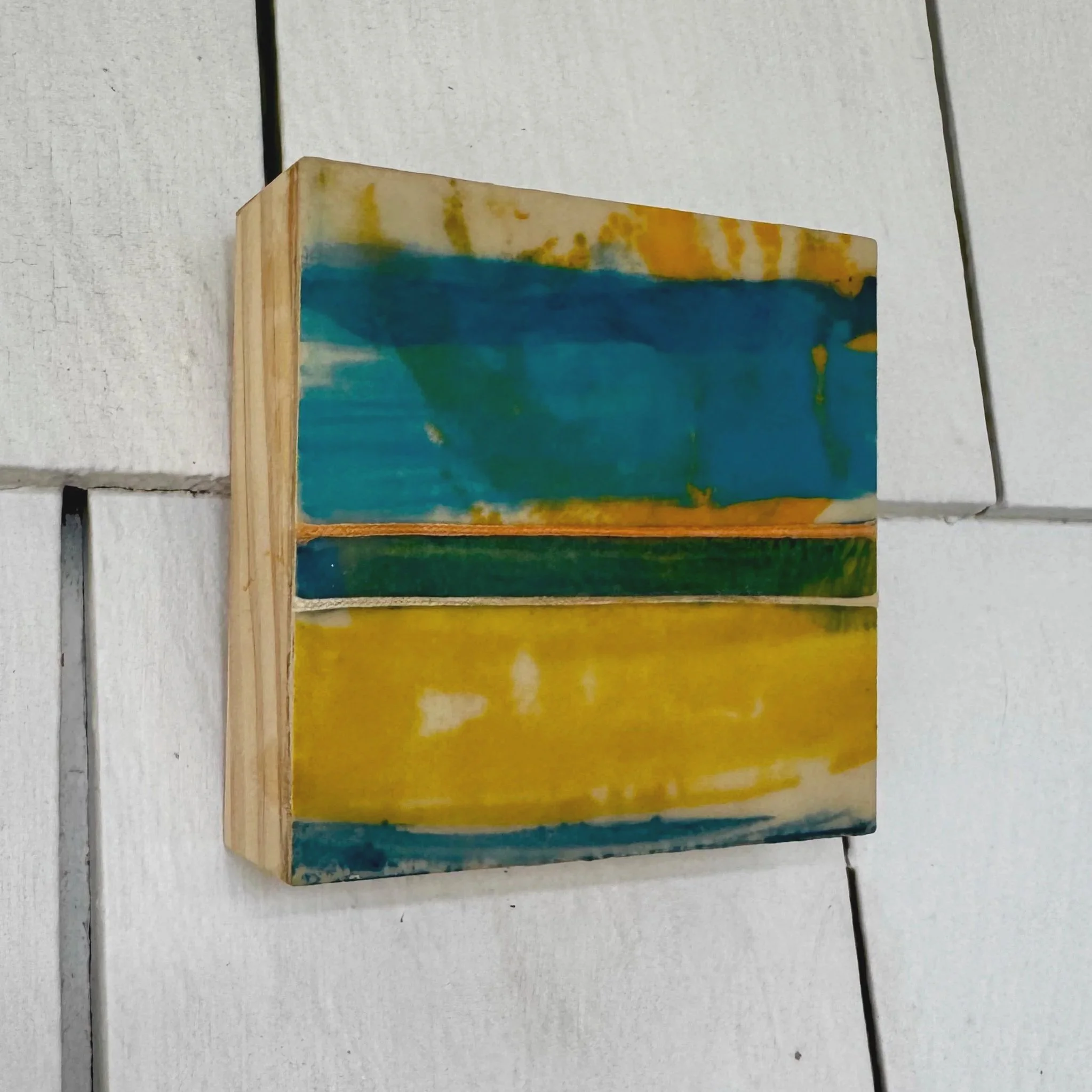 Afternoon Warmth, encaustic monotype and string on cradled panel, 4x4x1 in 