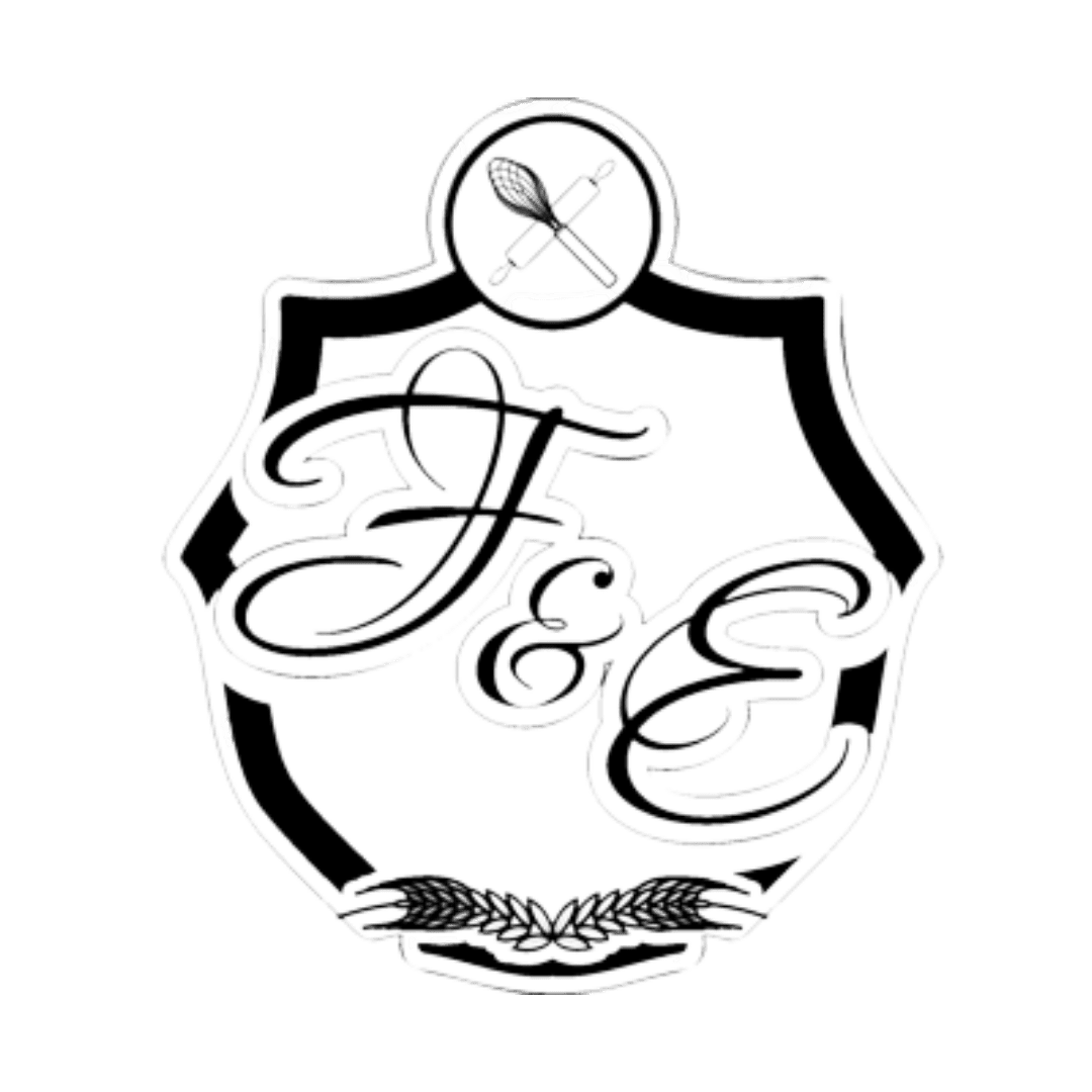 A black and white ornate emblem featuring a shield with swirling decorative elements and a small circle at the top showing crossed brush and sword.