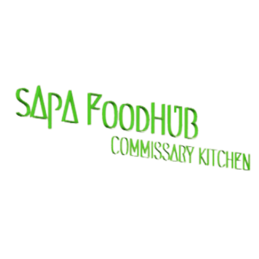 Neon sign displaying 'SaPa Foodhub' and 'Casualty Kitchen' in green letters on a black background.