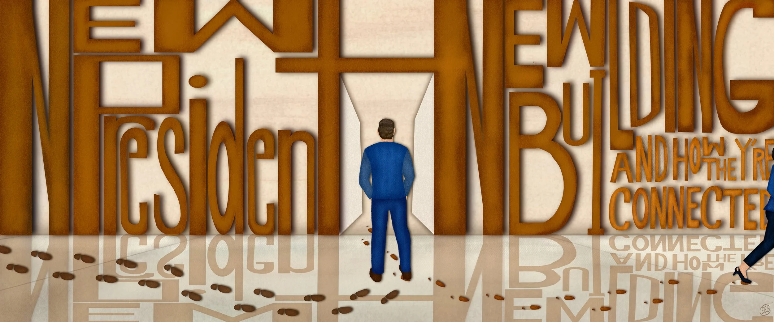 A man in a blue suit standing in front of a large wall with words related to building, constructing, and connecting, with a hallway ahead.