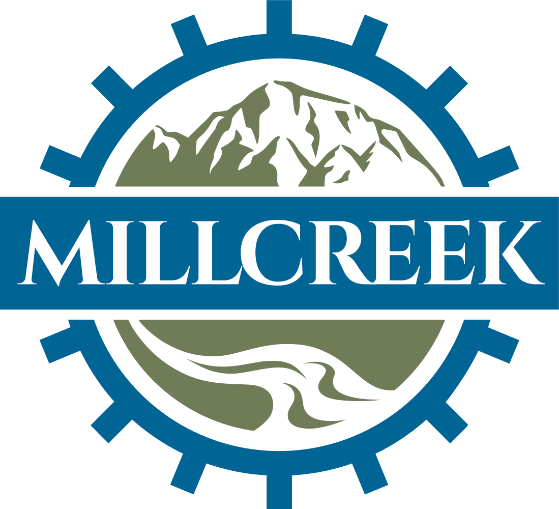 Logo featuring a mountain and river landscape with a gear outline, with the word 'Millcreek' in the center.