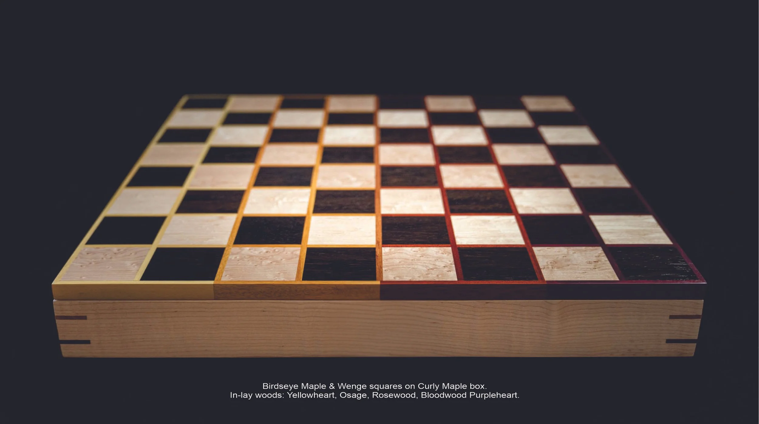 A chessboard with alternating 64 wood squares, made with birdseye maple and wenge, placed on a wooden box with inlay woods including yellowheart, osage, rosewood, and bloodwood purpleheart.