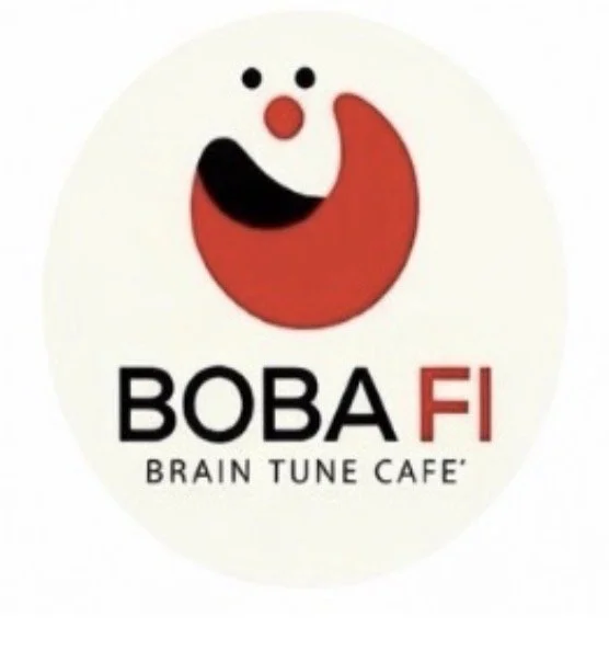 Logo for Boba Fi Brain Tune Cafe with a stylized clown face and a red, black, and white color scheme.