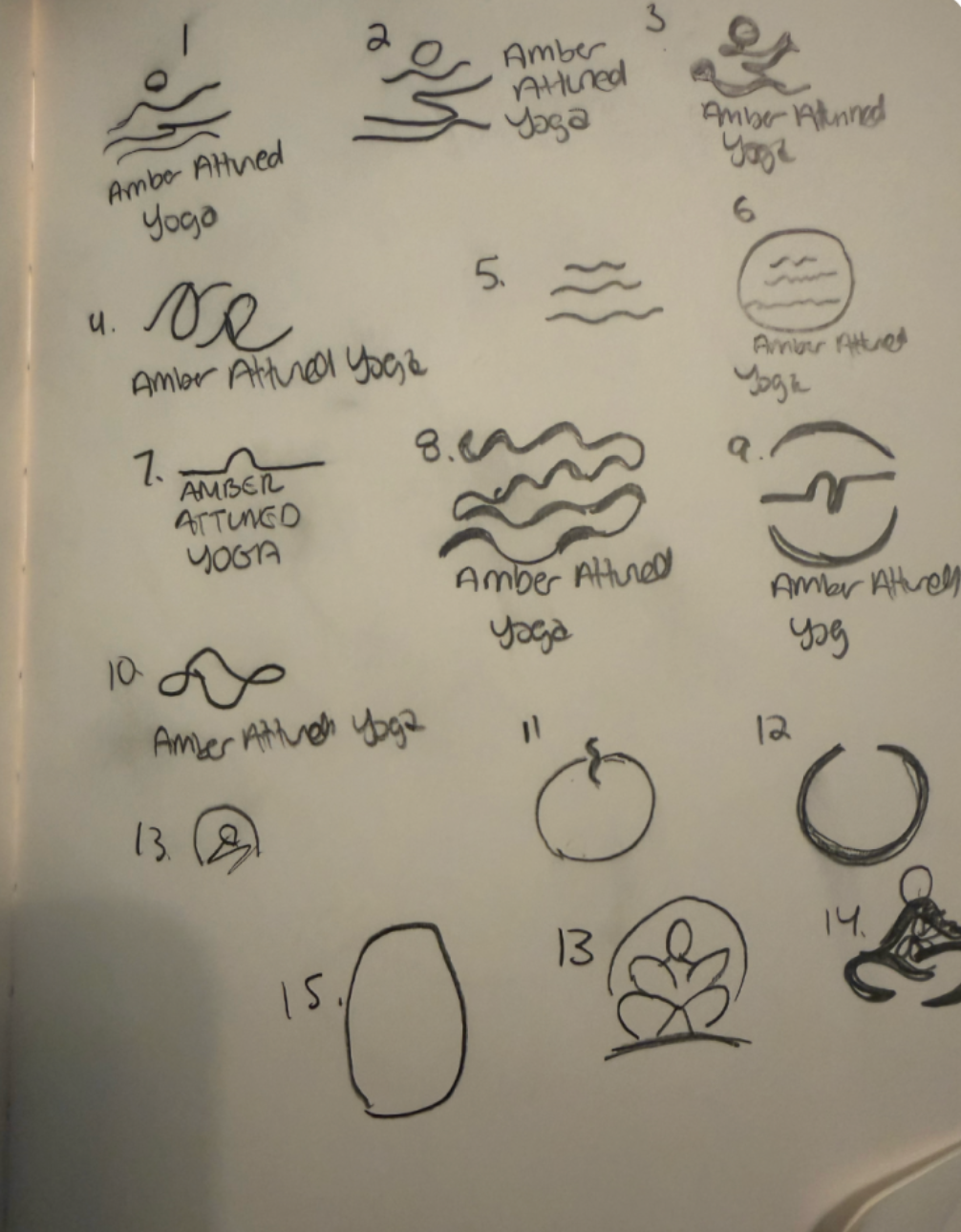 A sheet of paper with 15 hand-drawn yoga pose illustrations, each labeled with a number and the words 'Amber Attuned Yoga'.
