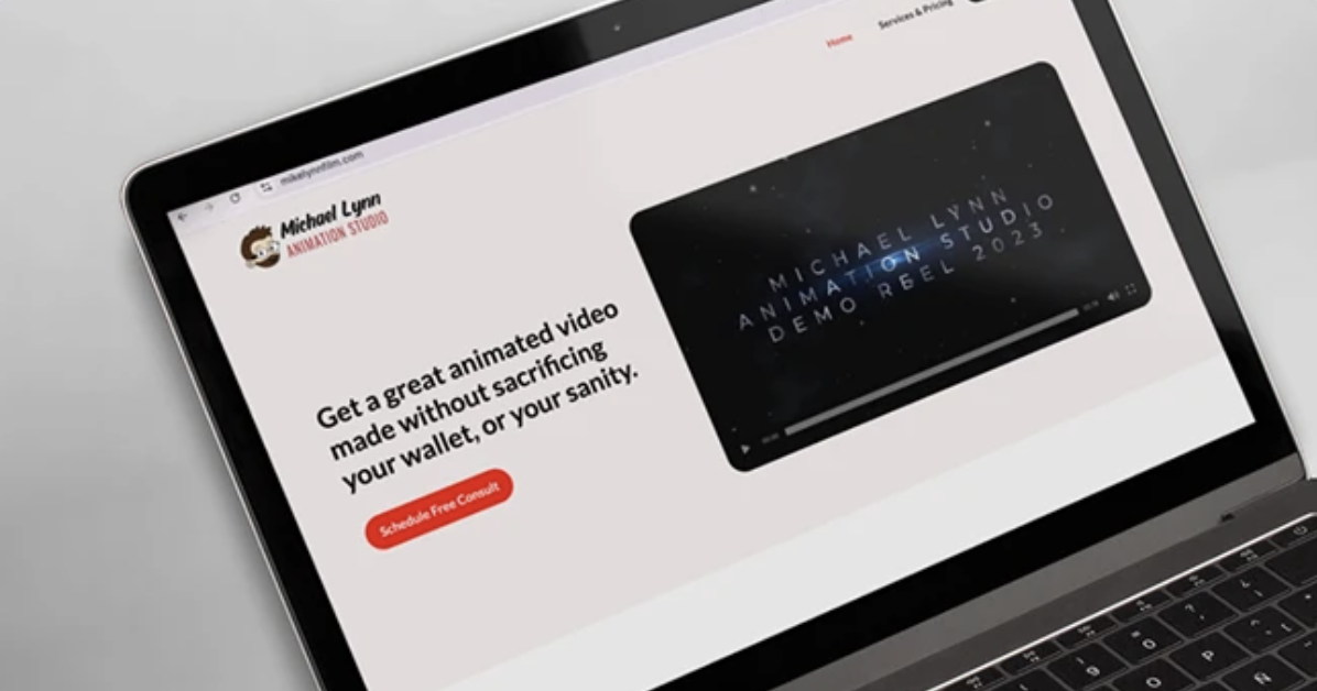 Laptop screen displaying a webpage for Michael Lynn Animation Studio featuring a promotional video and a red button that says 'Schedule Free Consult'.