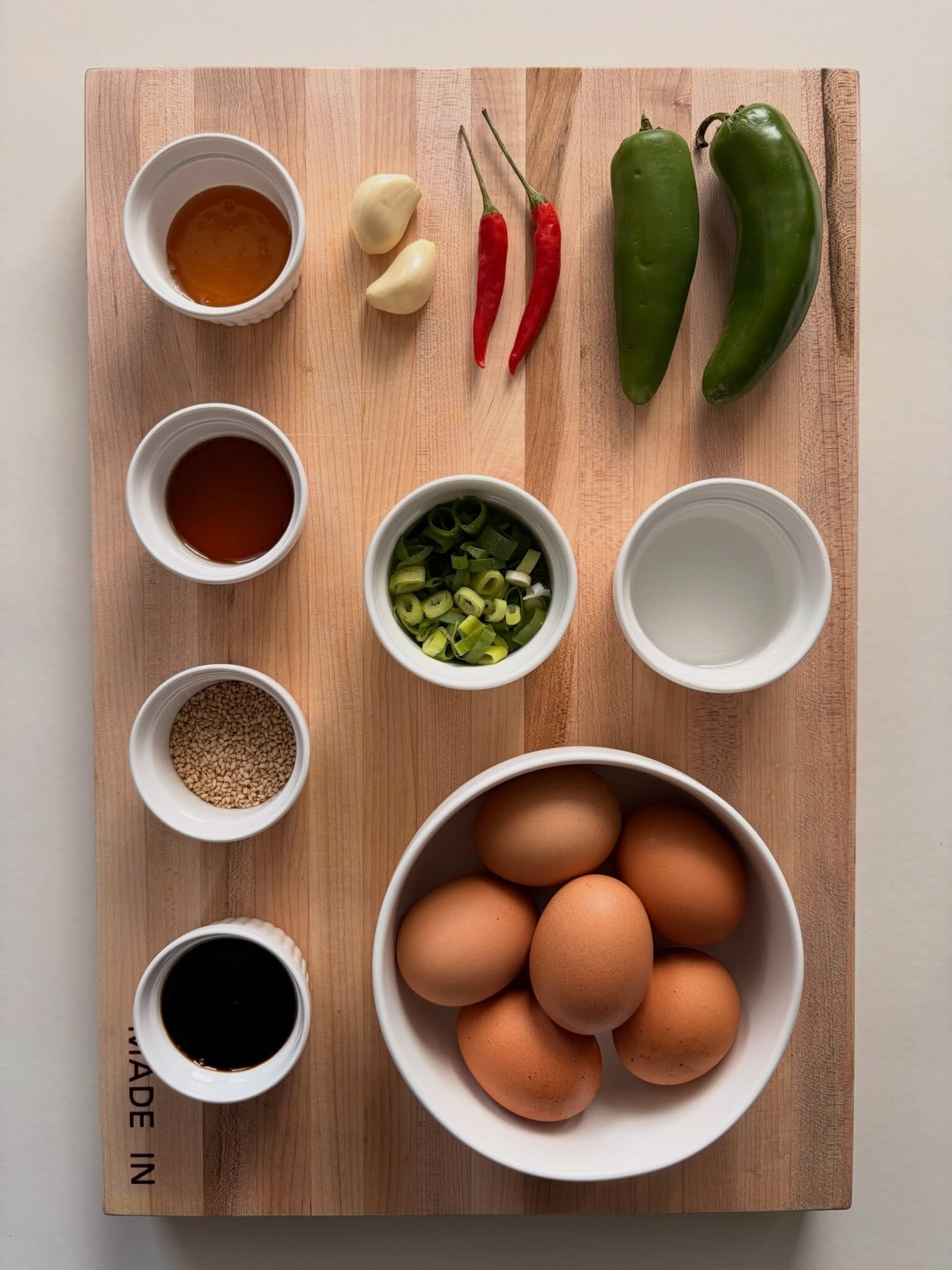 eggs. soy sauce. sesame oil. honey. garlic. green onion. jalape&ntilde;o. red chili. sesame seeds. 🥚🌶️swipe to see how it comes together &rarr;

mayak eggs 🥚🌶️
.
.
.
full recipe with step by step instructions at nomsbyjackie.com 🔗 (link in bio)