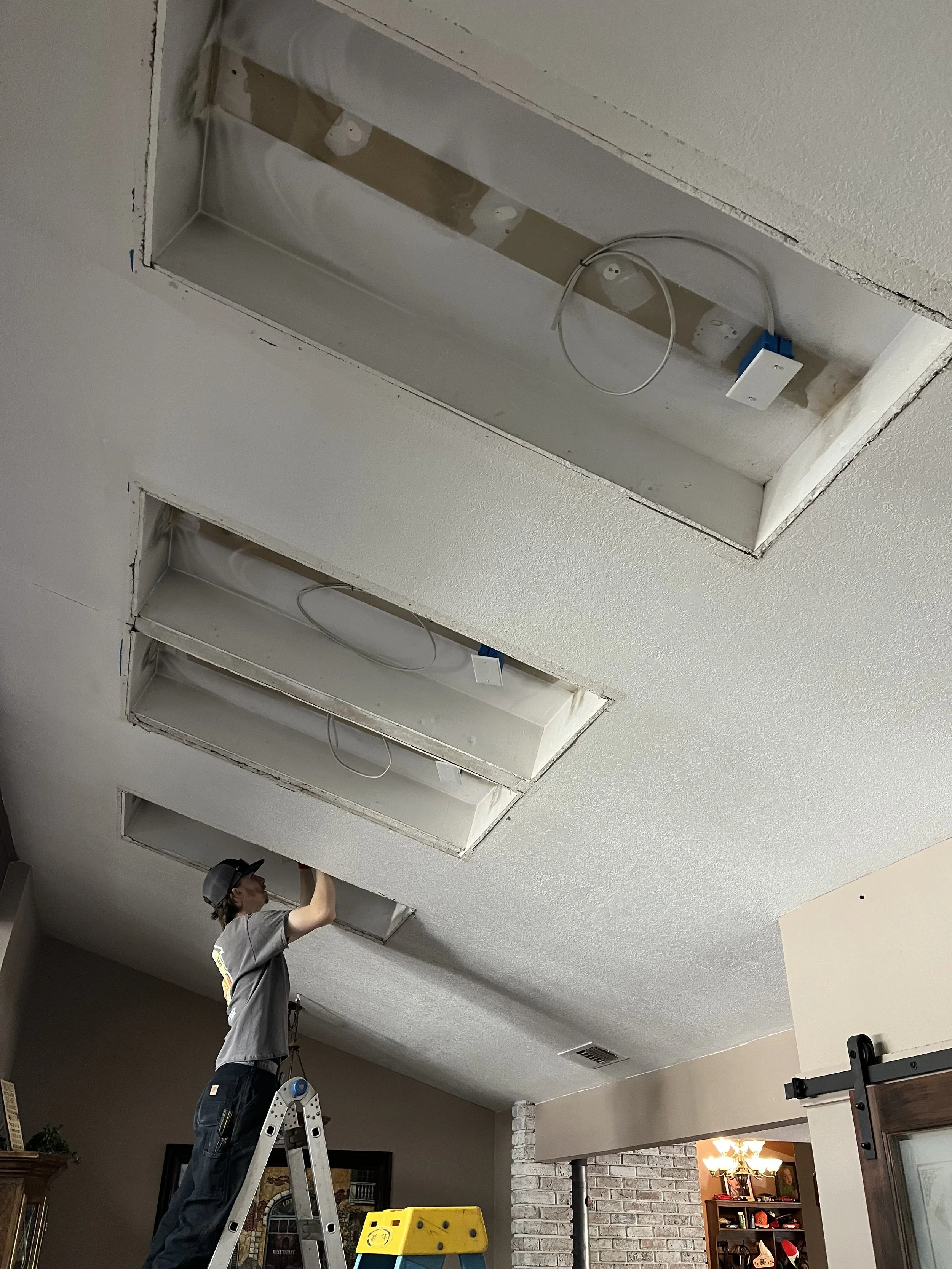 No job is too big for our crew. Wiring and light fixture install in high ceilings.
