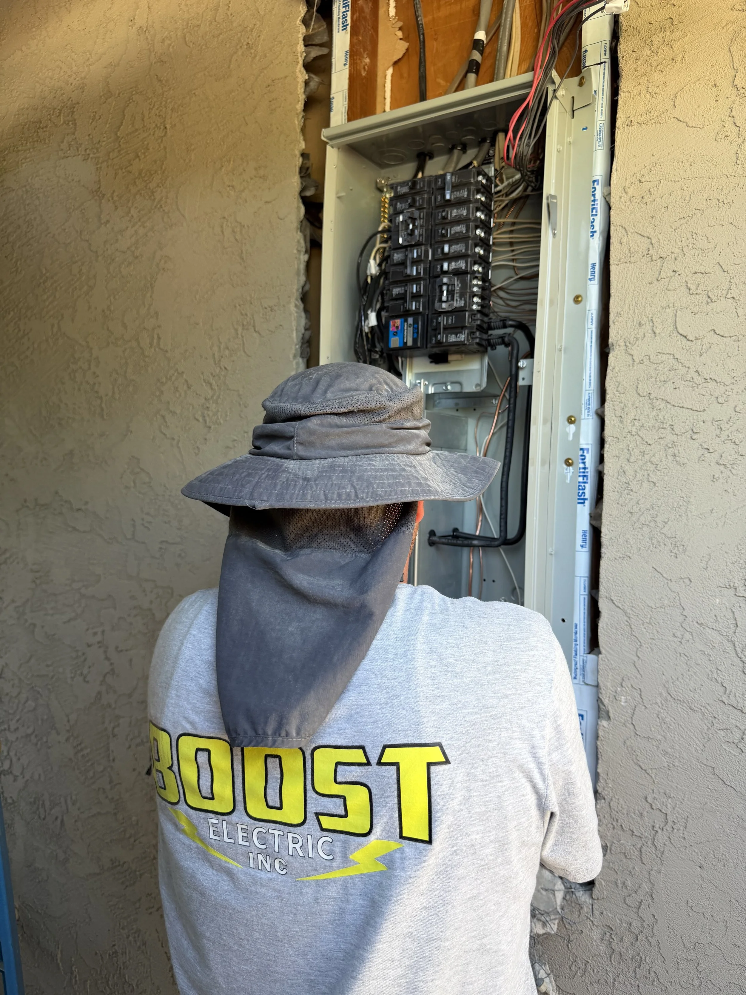 Boost Electric finishing the wiring for a new electrical panel.