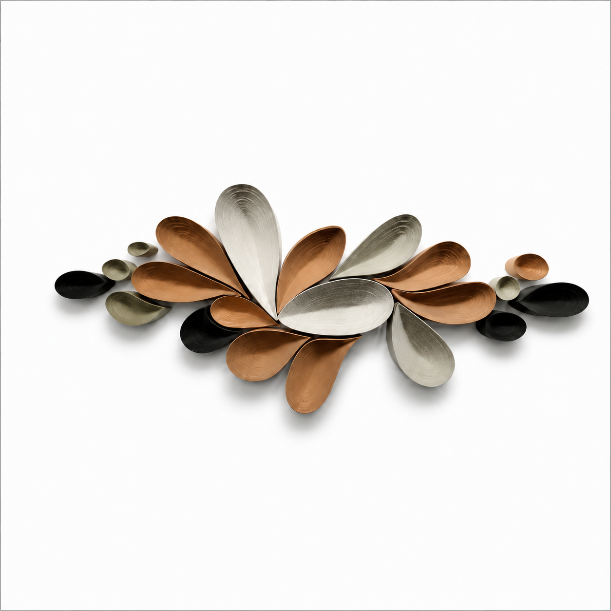 Decorative wall art composed of various metallic and plastic petal-shaped pieces in black, gold, and silver, arranged in a symmetrical pattern.