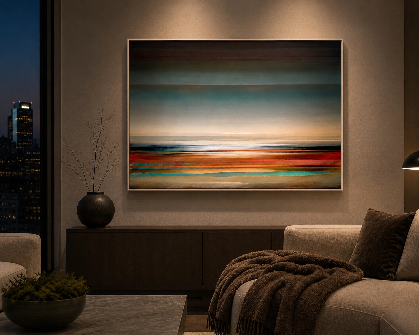 Living room with framed abstract landscape painting, vases, and furniture, overlooking city skyline at night.