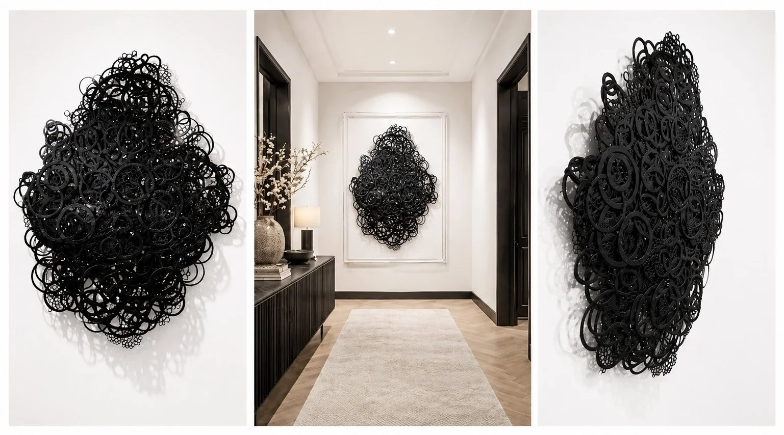 Contemporary interior hallway with black abstract wall art on white walls, a beige rug, a console table with a decorative vase, a table lamp, and framed black wall art.