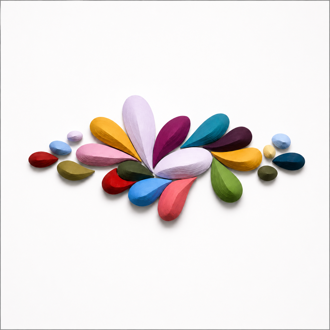 Colorful painted wooden petal-shaped pieces arranged on a white background to resemble a flower.