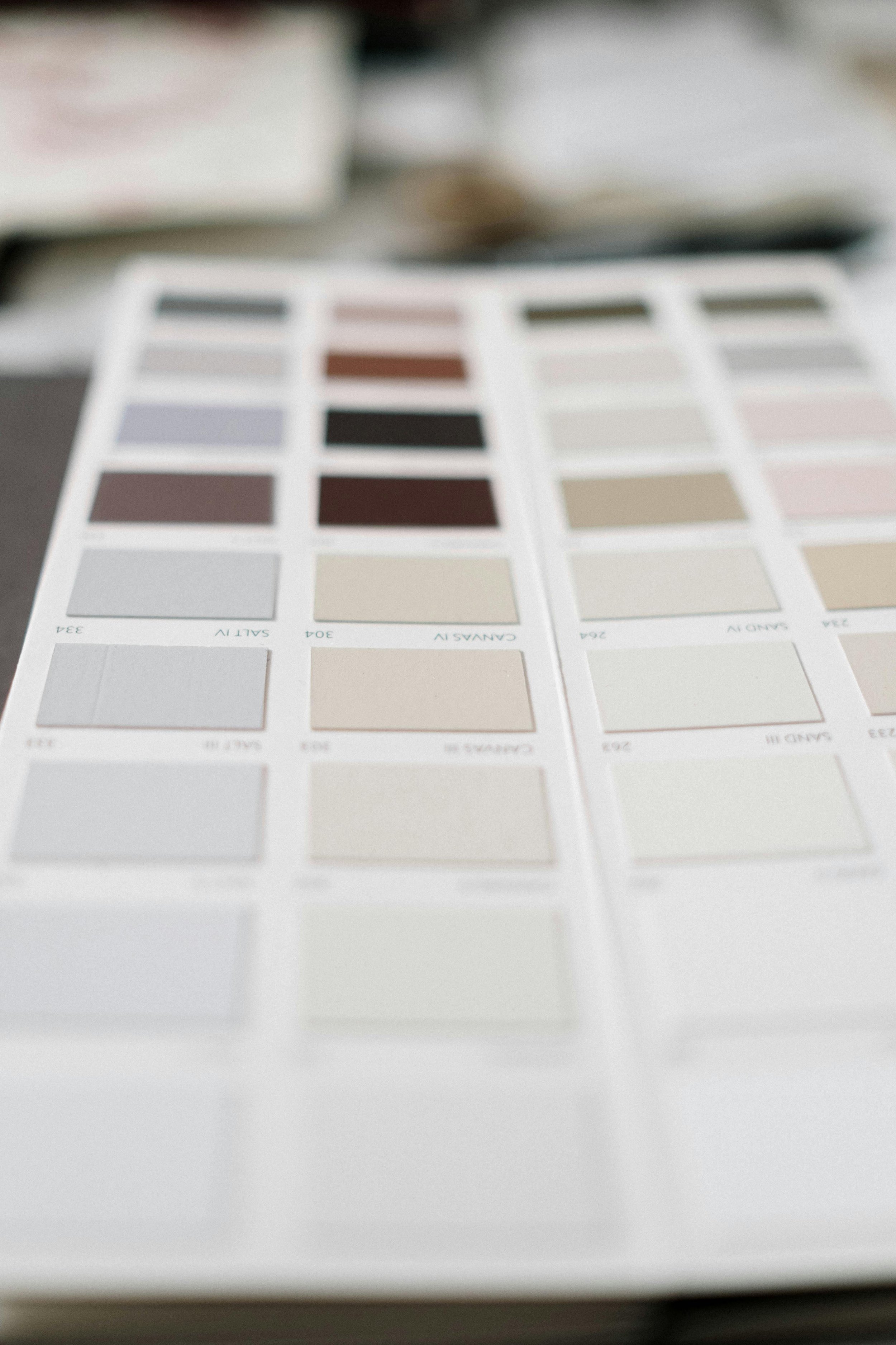 Blurred color swatch sample chart with multiple color options in a grid layout.