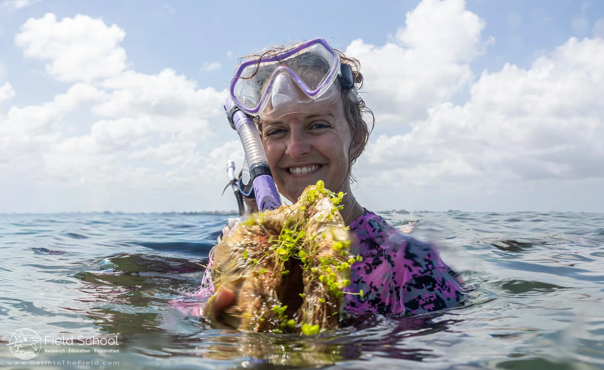 Emporia State University student holding a Queen Conch