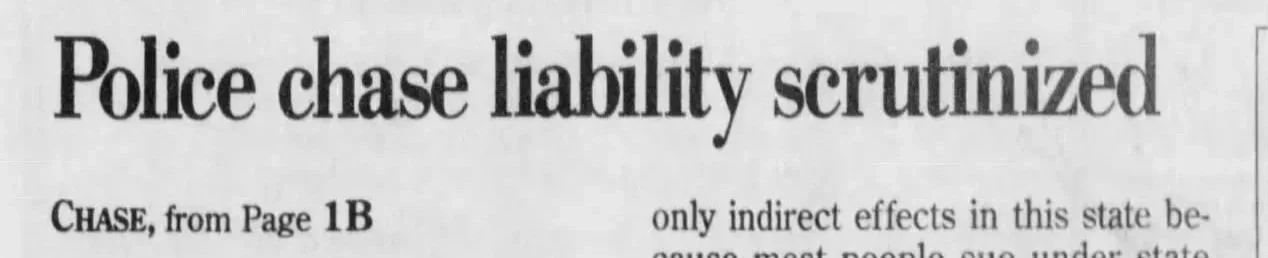 Newspaper headline reading 'Police chase liability scrutinized'.