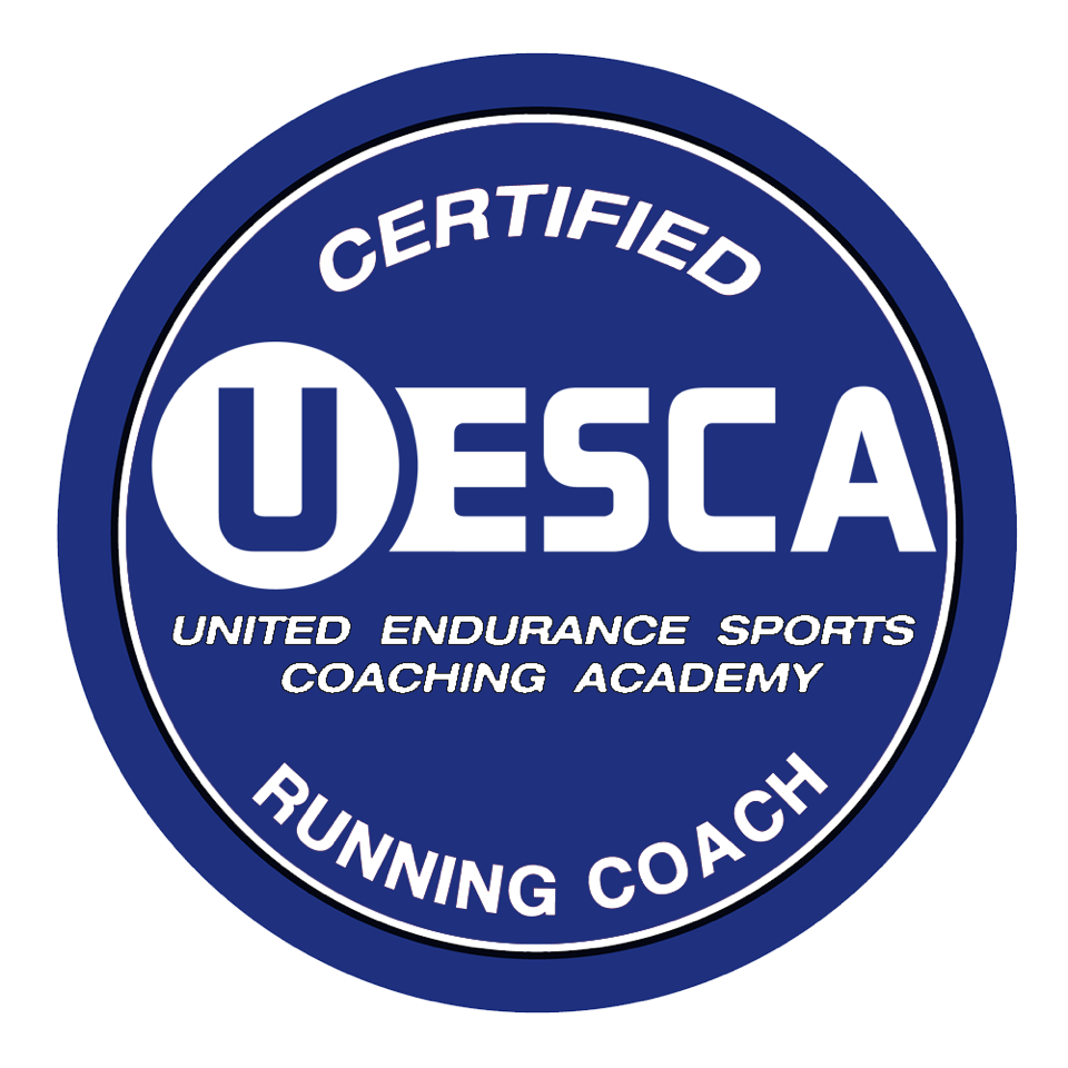A circular logo with a blue background and white text that reads 'Certified USCA' at the top, 'Running Coach' at the bottom, and 'United Endurance Sports Coaching Academy' in the middle.