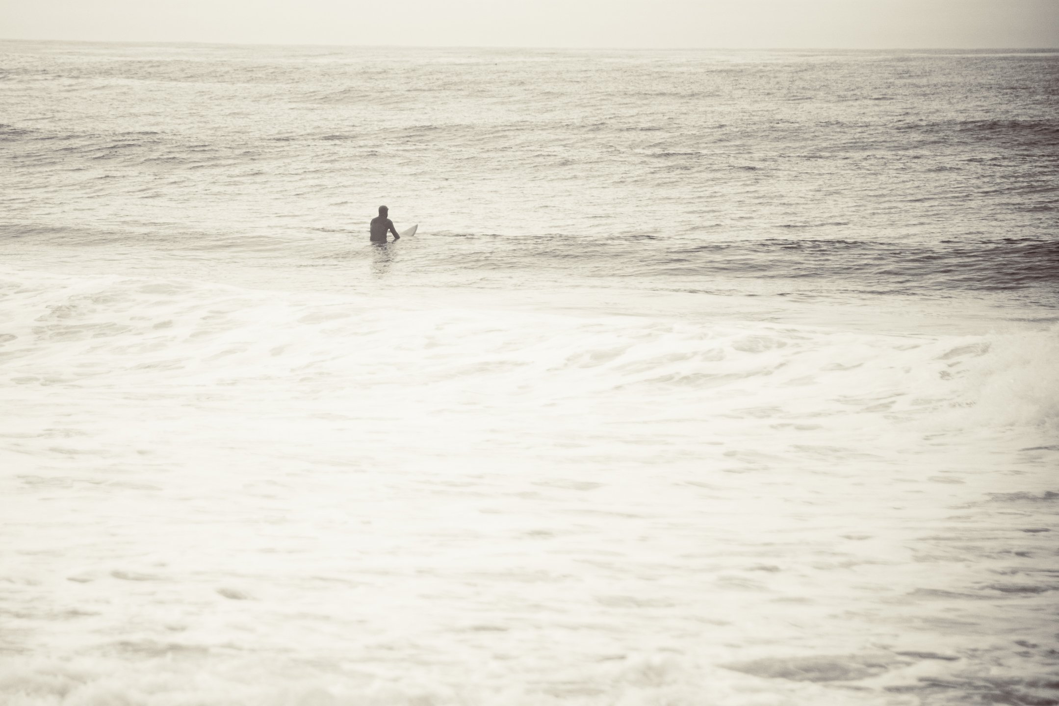 lone-surfer-haystack-rock-pacific-city-oregon.jpg