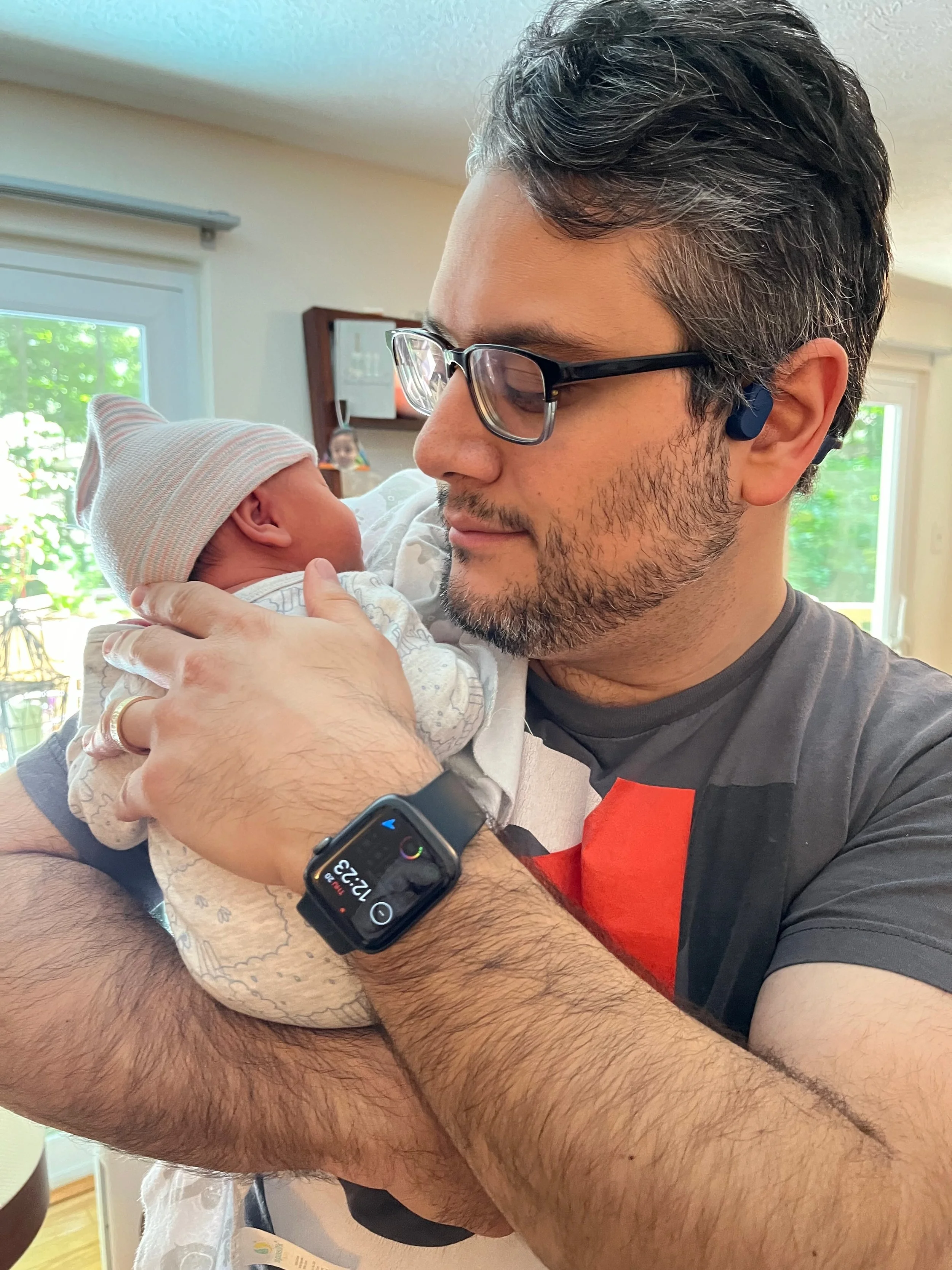 José Pitti holding his baby daughter.