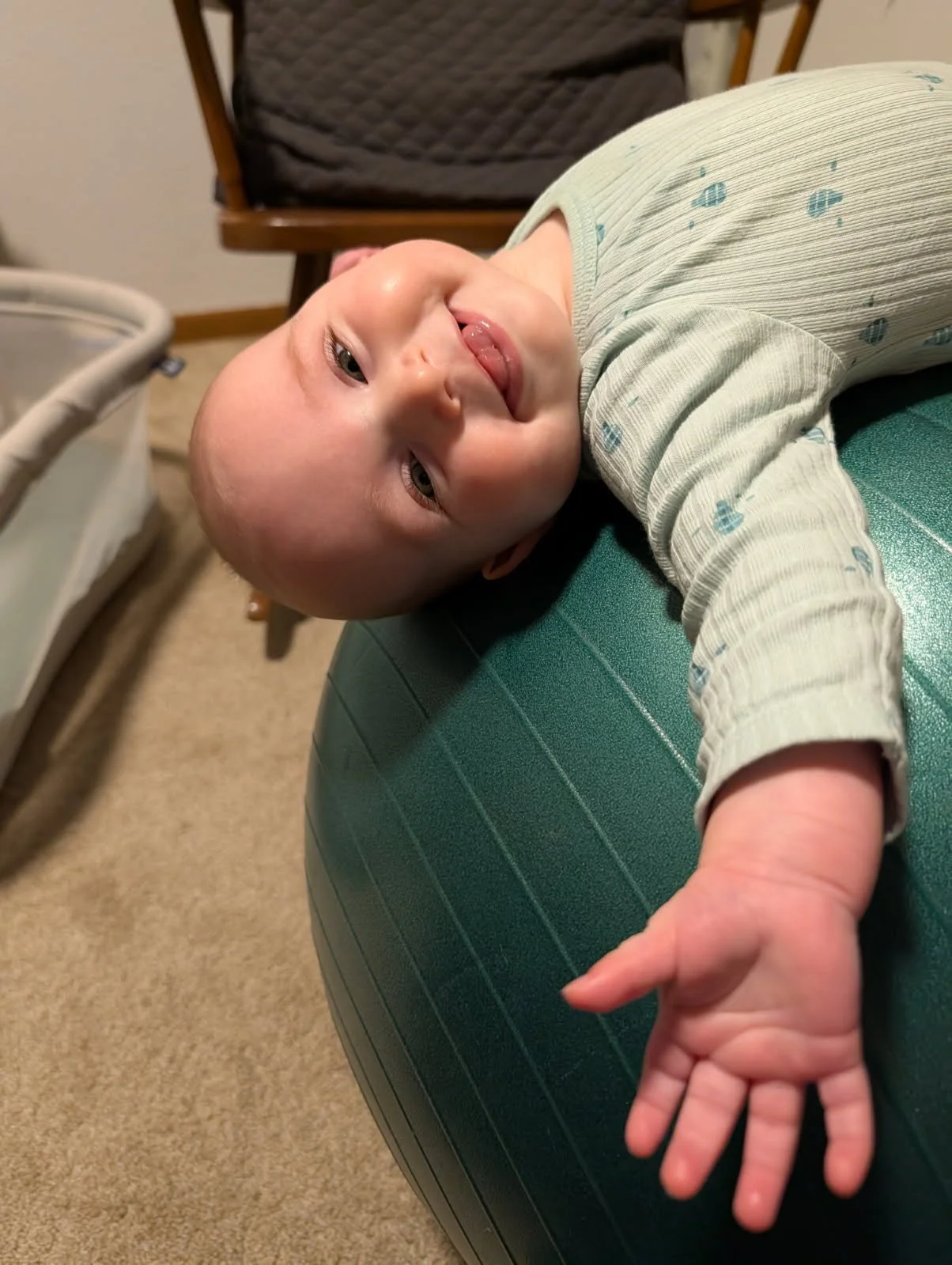 Parent staying close to their baby during an Infant Craniosacral Fascial Therapy session