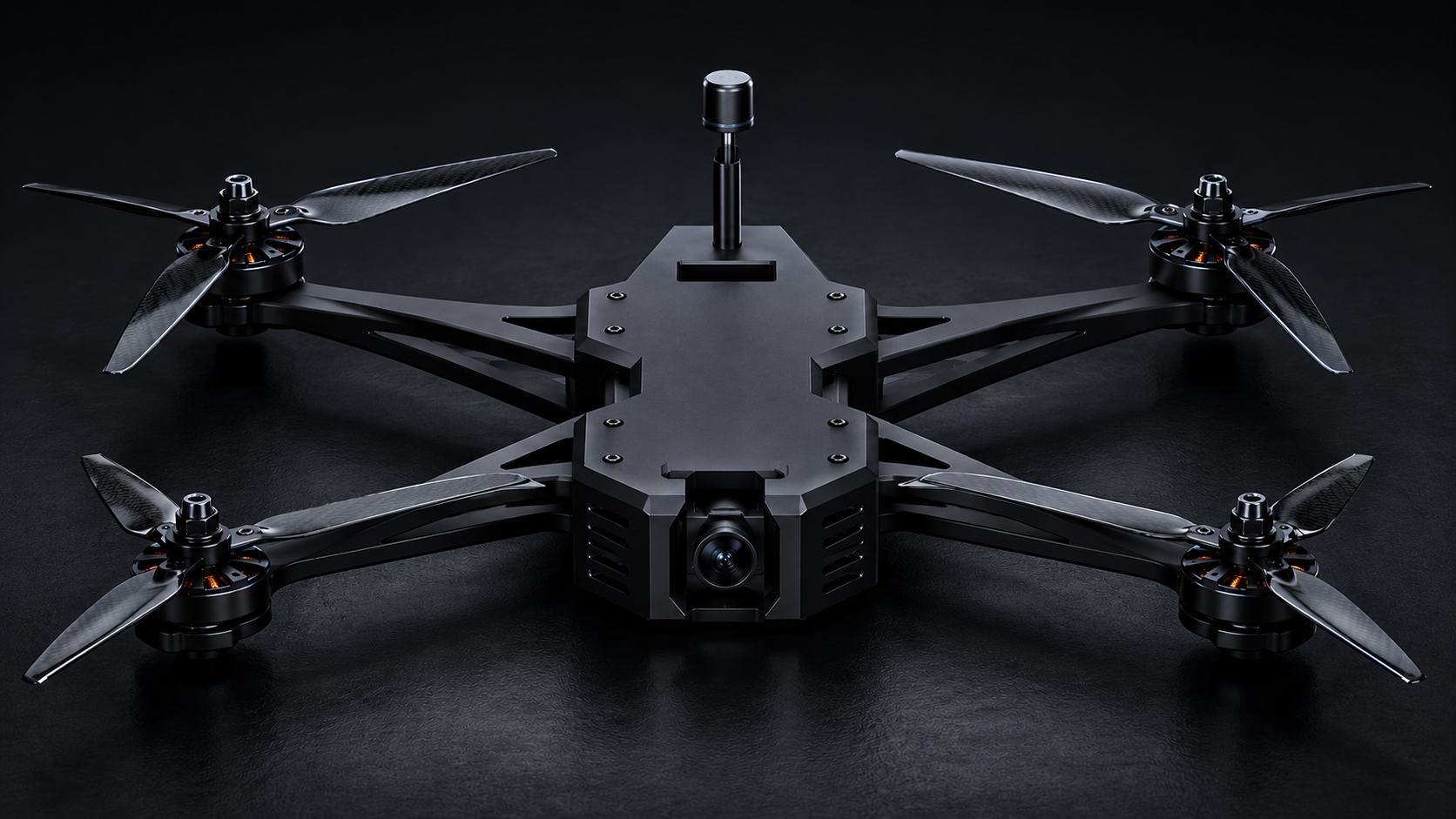 A black quadcopter drone with four propellers, a camera on the front, and a central antenna, resting on a dark surface.