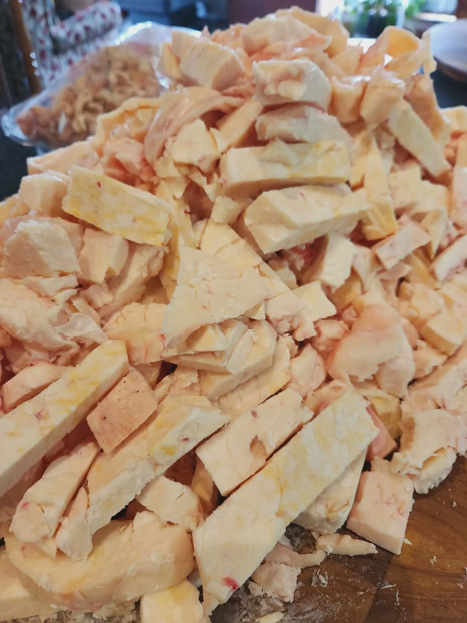 Close-up of chopped tallow in a wooden bowl,