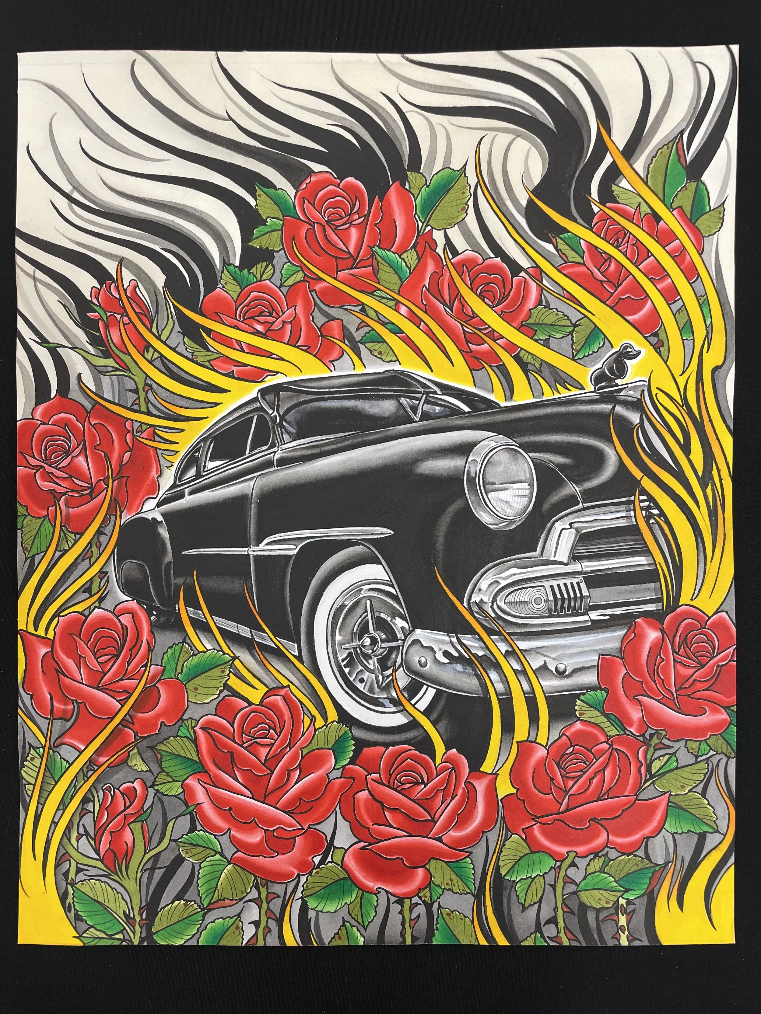A tattoo-style illustration featuring a black vintage car surrounded by vibrant red roses and green leaves. Yellow and black wavy flames extend from the roses and car, set against a black and gray swirling background.