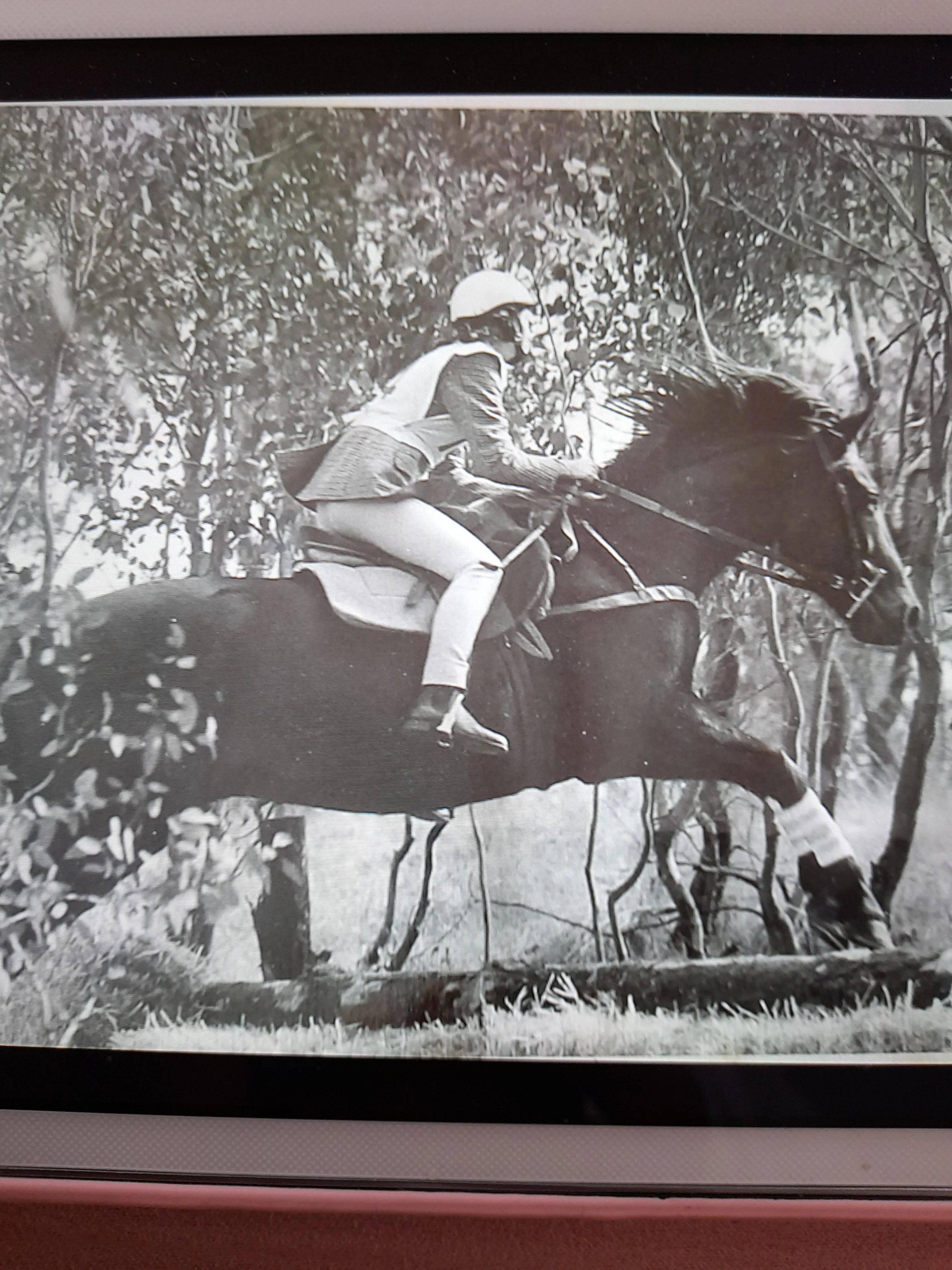 Cheryl riding in a cross country race, Jean took this photo