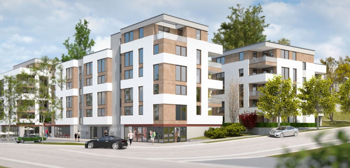 Moderne Mehrfamilienhäuser mit weißen Wänden, großen Fenstern und Balkonen, umgeben von Bäumen und begrünten Flächen, mit einigen Autos und Fußgängern auf der Straße.