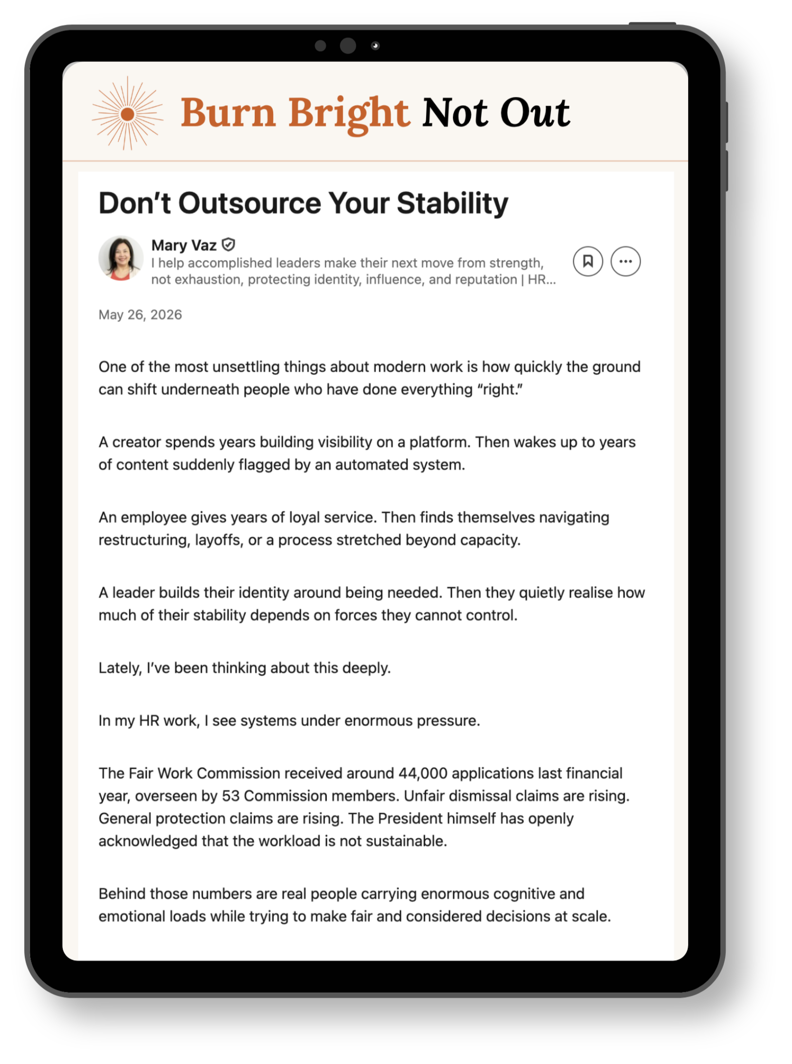 A smartphone screen displaying an article titled "Burn Bright Not Out" with the subtitle "Don't Outsource Your Stability" by Mary Vaz, dated May 26, 2026. The article contains multiple paragraphs discussing workplace stability, workload, and systemic pressures.