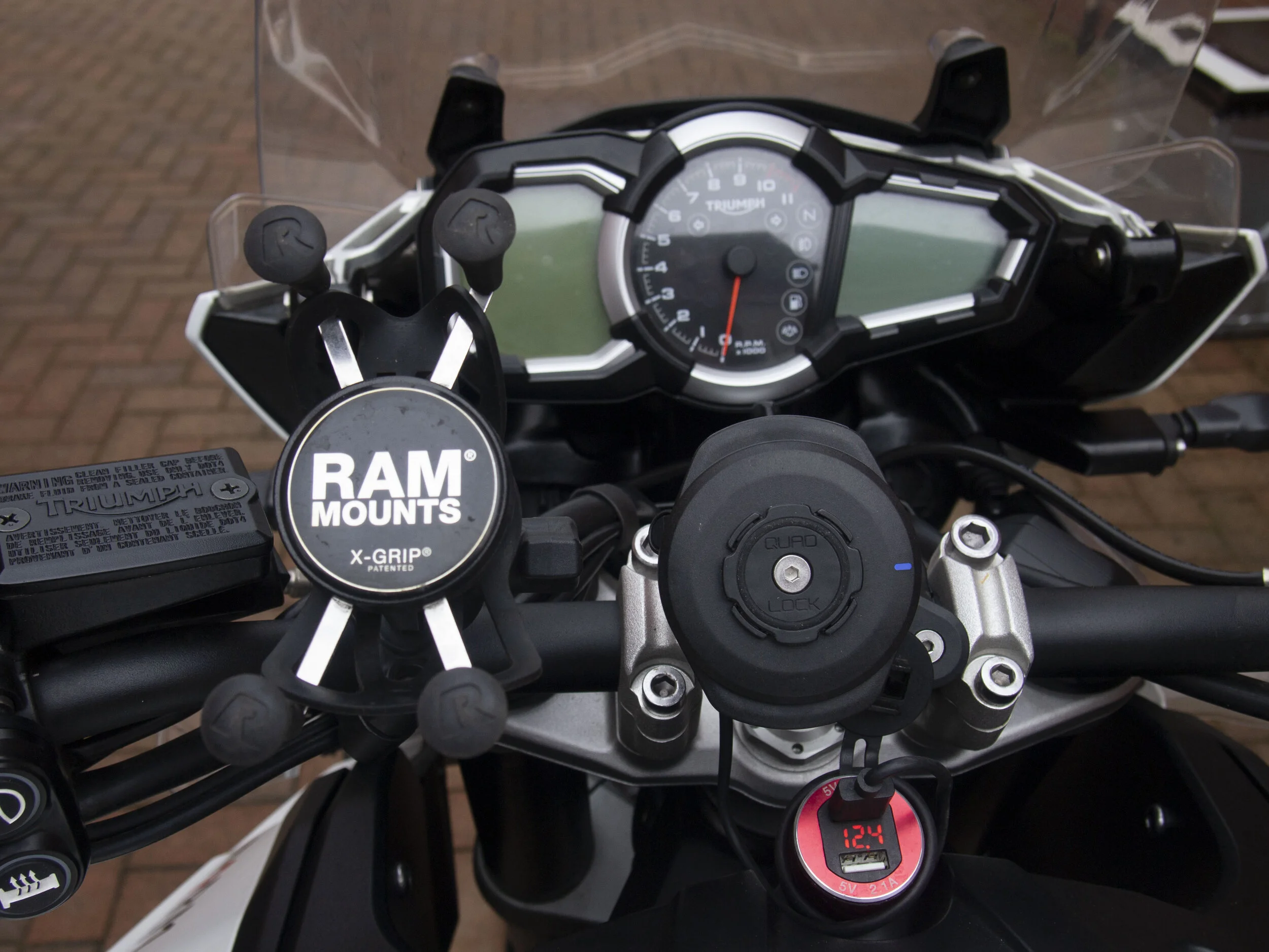 The Quadlock looks neater, the X Grip does the job