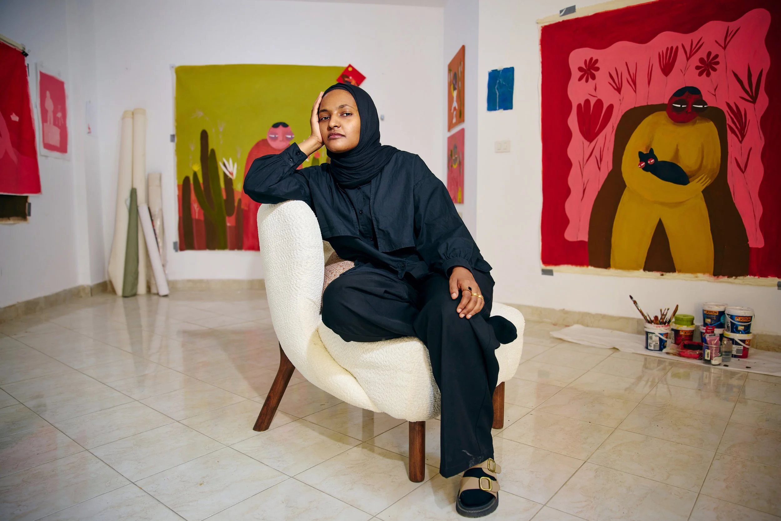 Sudani Artist Reem Aljeally in her studio in Cairo, Eygpt. Alternate world building through painting, architect by trade.