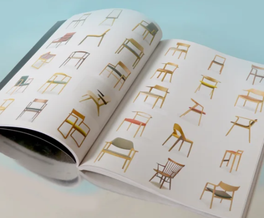 Open book showing various illustrations of different chair designs on white pages.