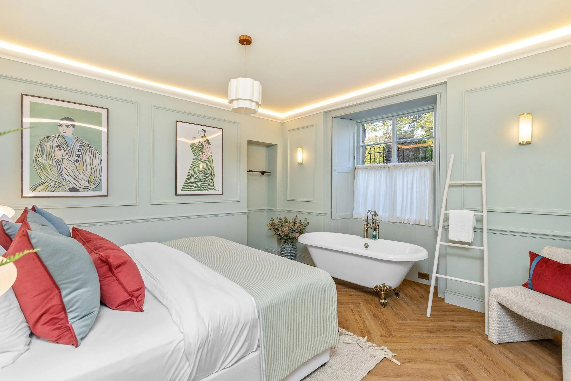 Renovated bedroom with roll-top bath, panelled walls and herringbone floor at Drummond Place, Stirling, by SANNA Design Studio