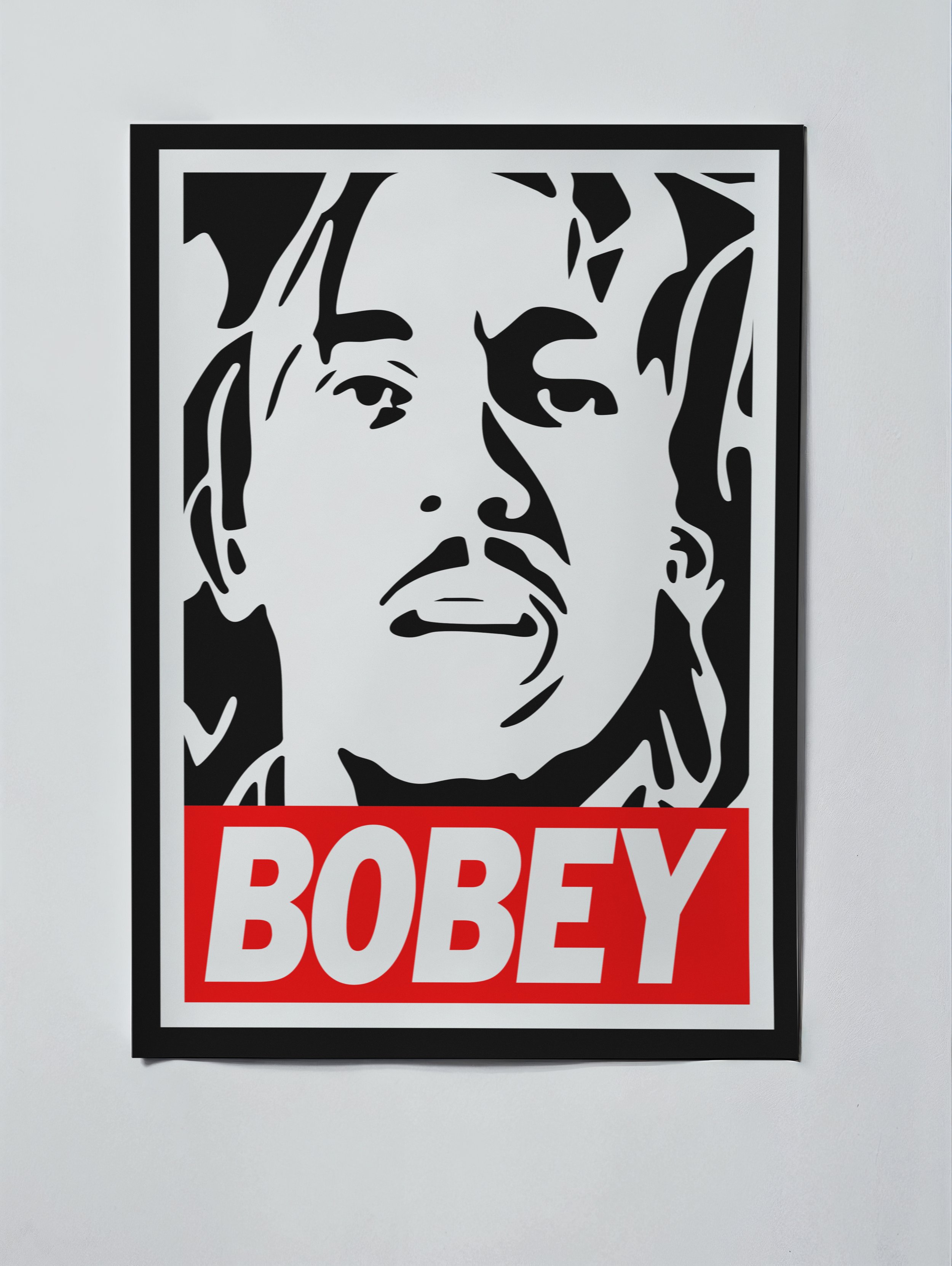 BOBEY is a graphic tribute to Bob Marley built from the visual language of the iconic Obey poster style. By adding a single letter and reworking the familiar format around Marley’s portrait, the piece becomes a playful act of visual appropriation — b
