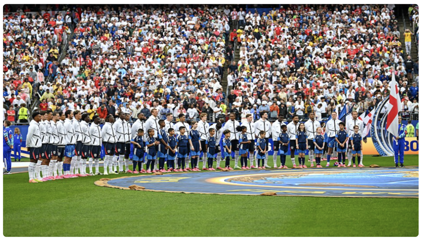 England players and mascots line up before a World Cup match