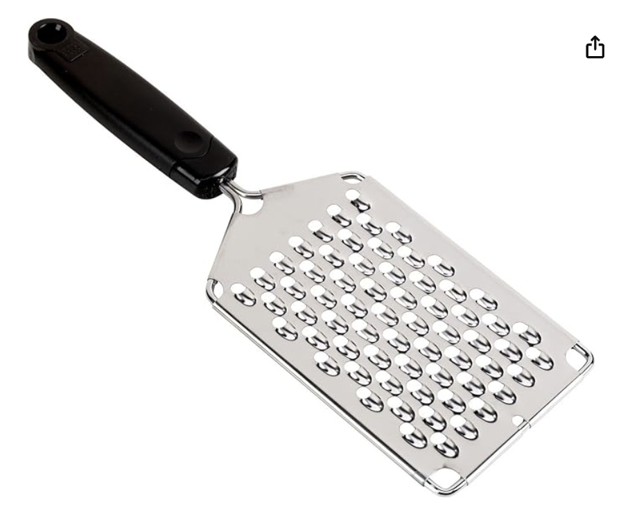 Handheld cheese grater
