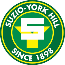 Suzu-York Hill logo with a green and yellow color scheme, featuring a large letter 'E' and the text 'SUZU-YORK HILL SINCE 1898' circularly around it.