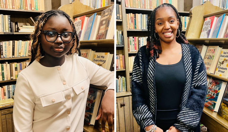 Two women standing in front of bookshelves in a bookstore, smiling and posing for the camera.