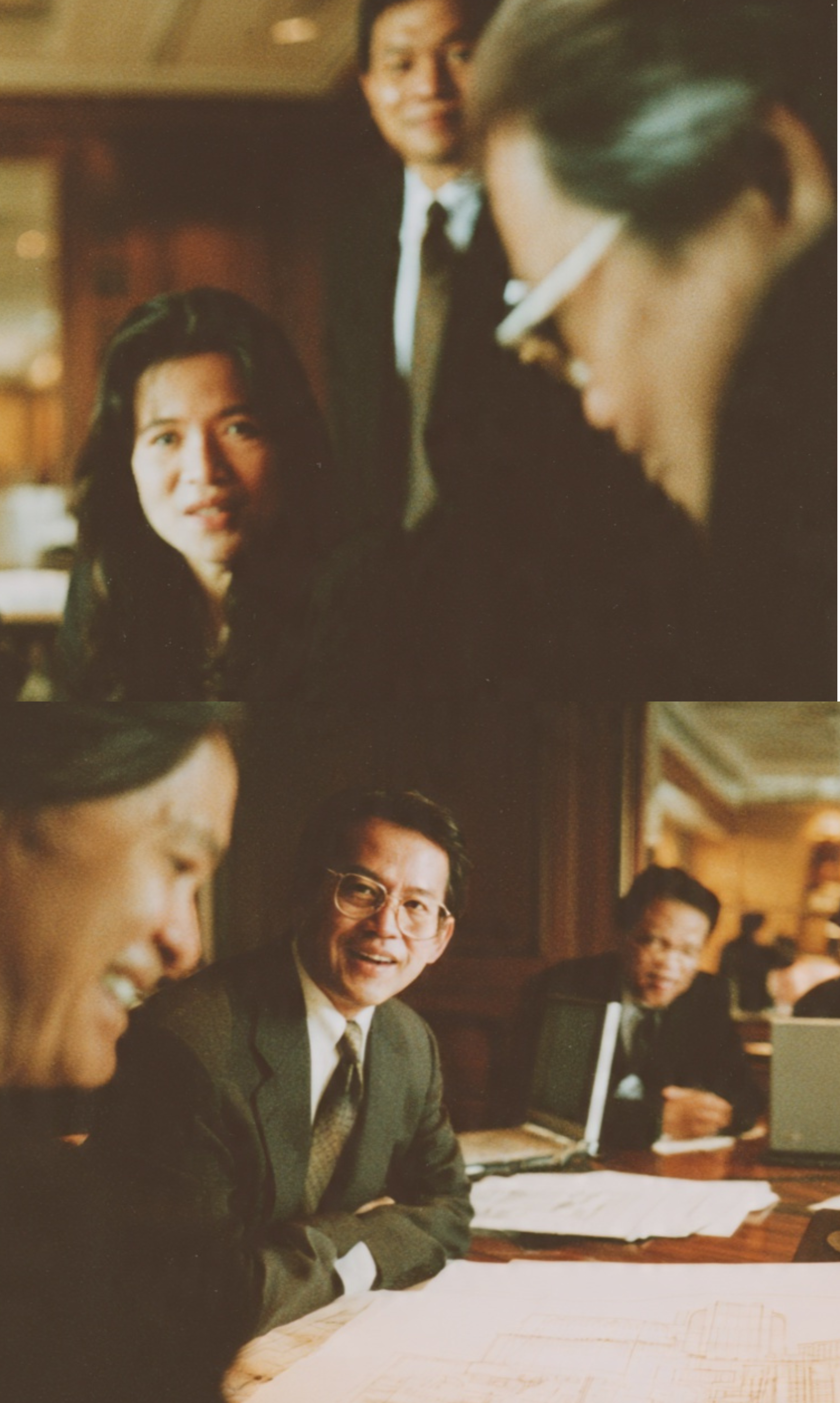 A photograph of hotel managers and board members meeting at a large table in 1990s.
