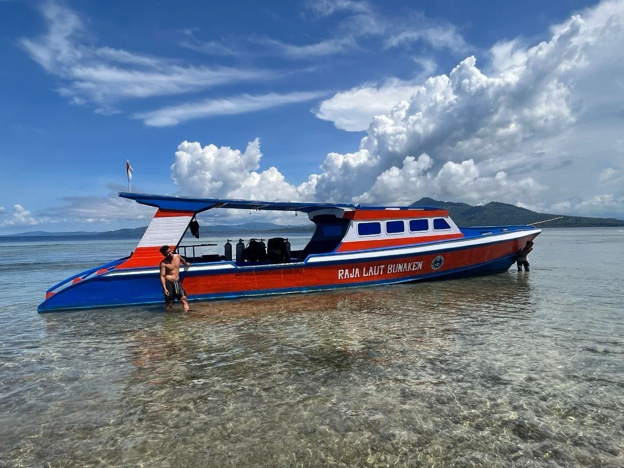 One of Raja Laut Dive Resort's boat, idling between corals.