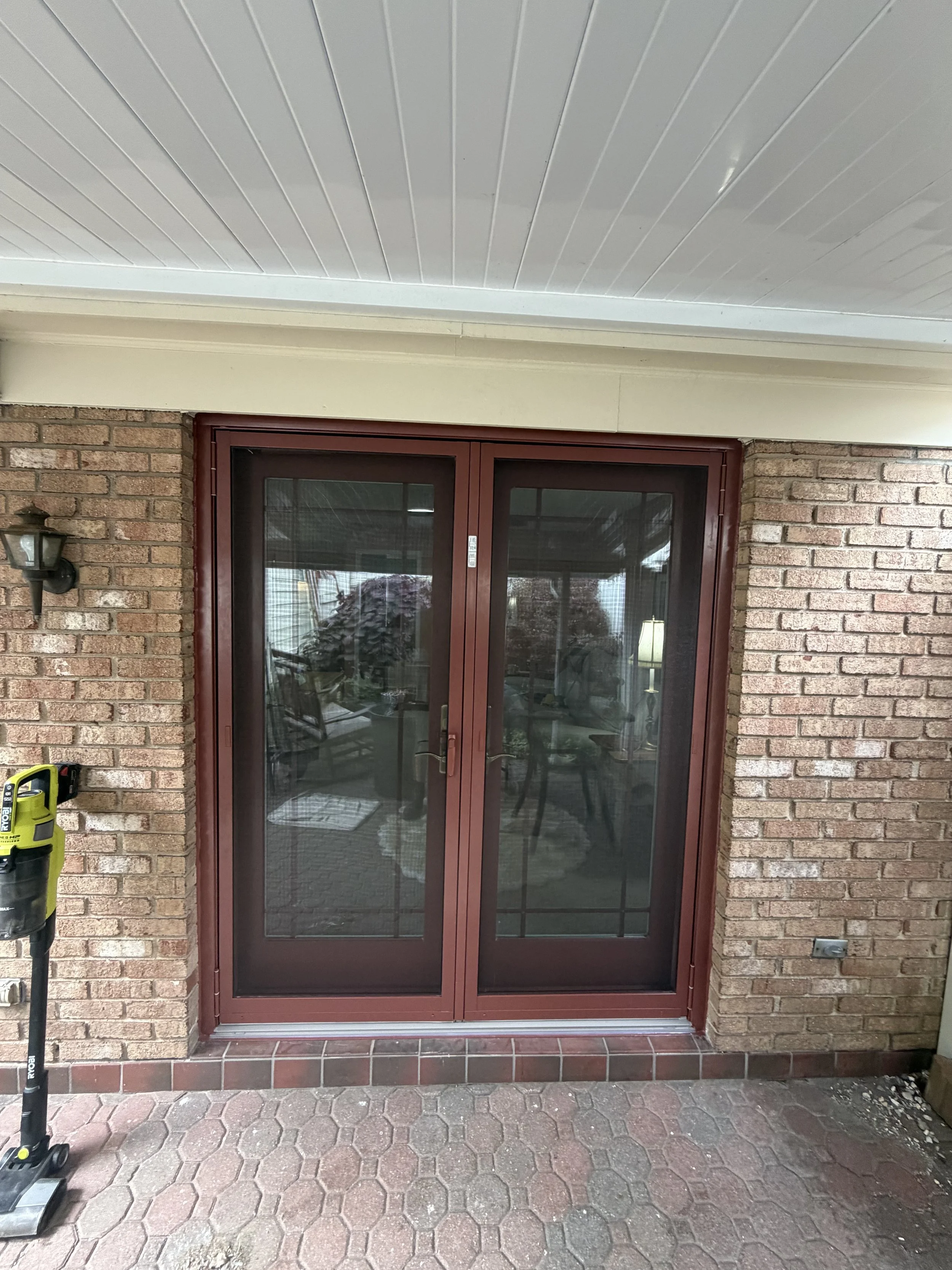 Brand new French door with hinged screen doors.