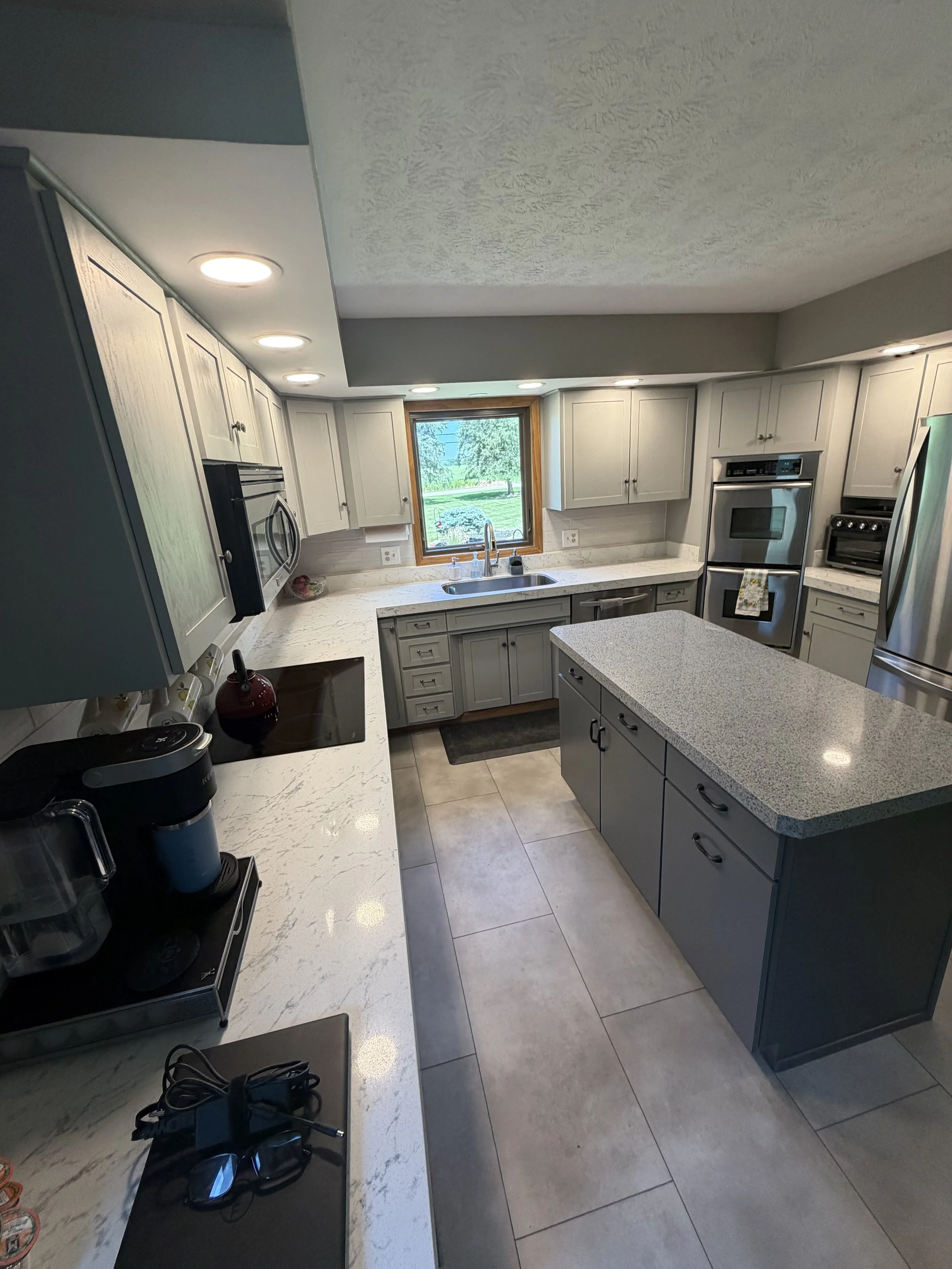 Updated kitchen face lift, backsplash and countertops