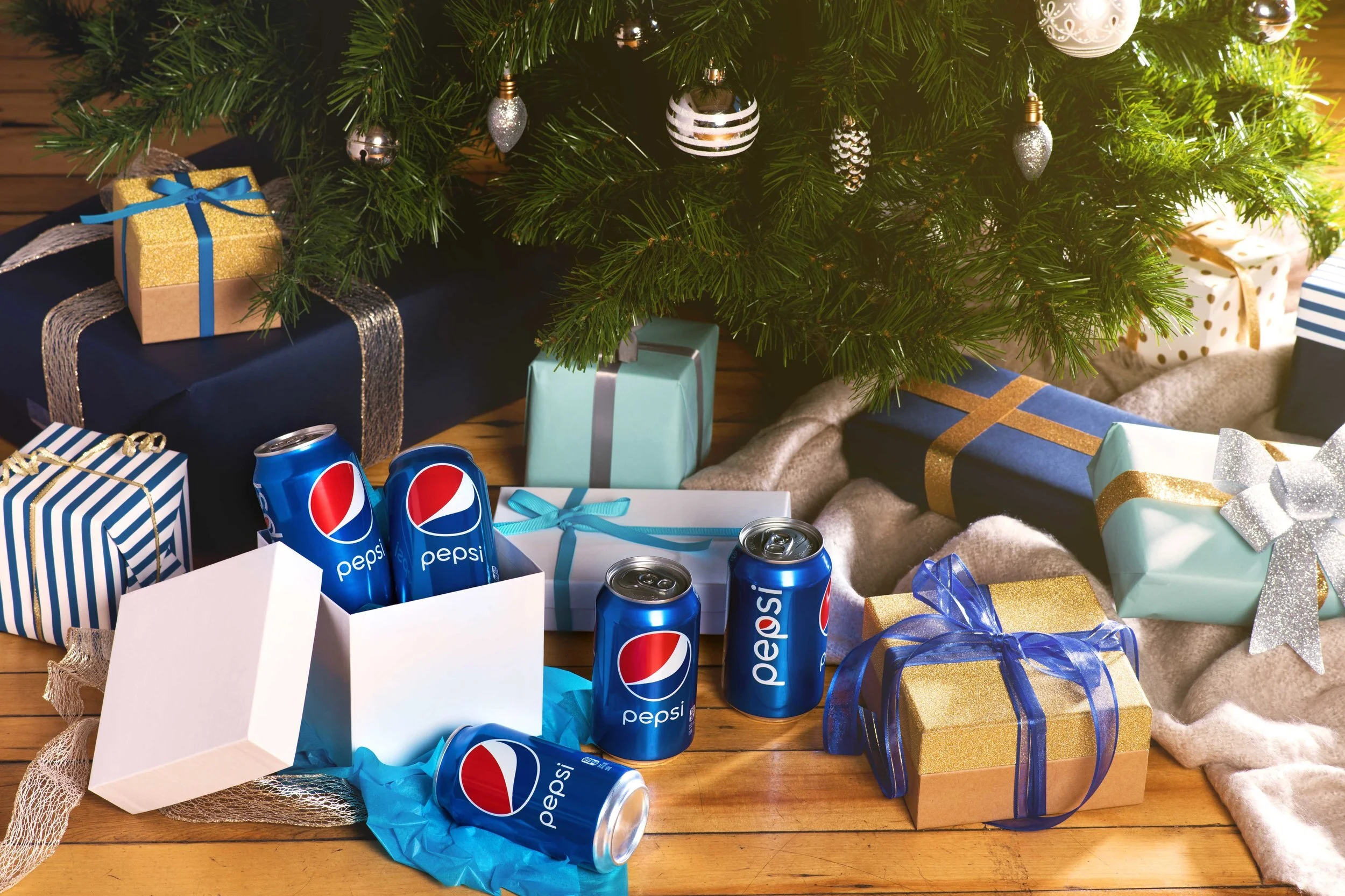  Gift boxes holding cans of Pepsi under the Christmas tree. Image created by Dublin Photographer, El Keegan 