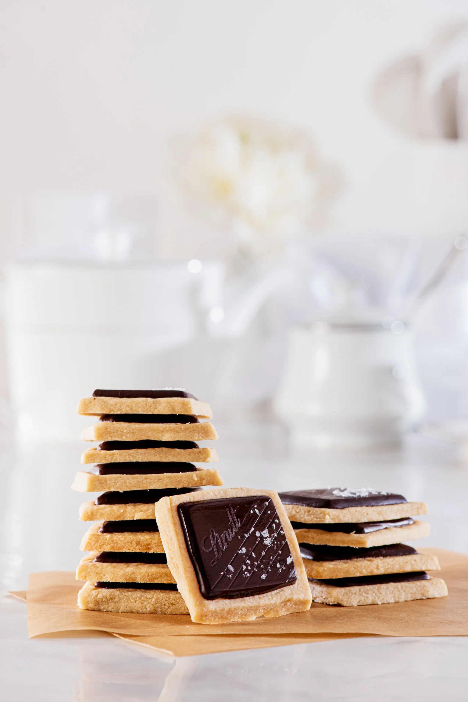  A stack of shortbread biscuits with a thick dark chocolate top on a white background. Food photography created for Lindt by Dublin Photographer, El Keegan.  