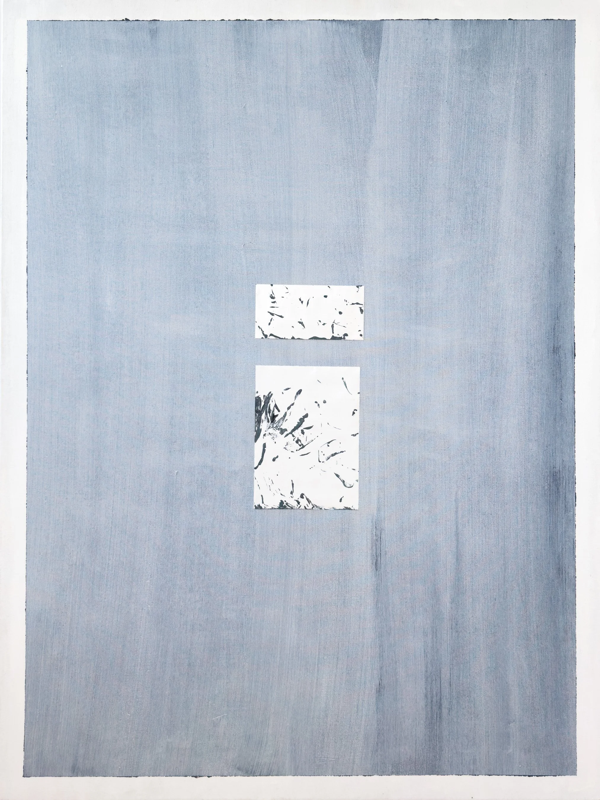 Two rectangular pieces of paper with black abstract designs on a white background, placed on a large sheet of light blue paper.