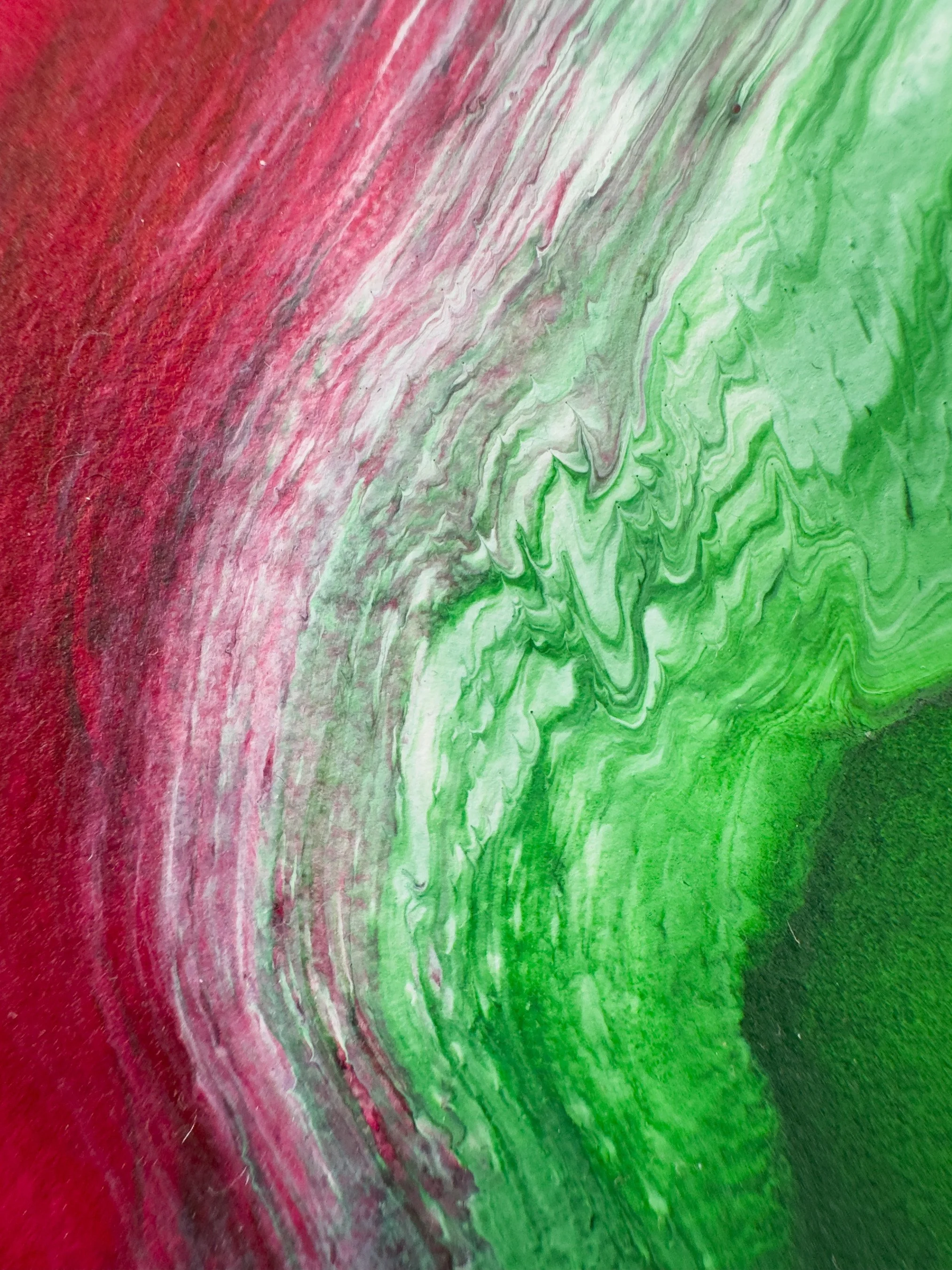 Abstract painting with red, pink, white, and green swirling patterns.